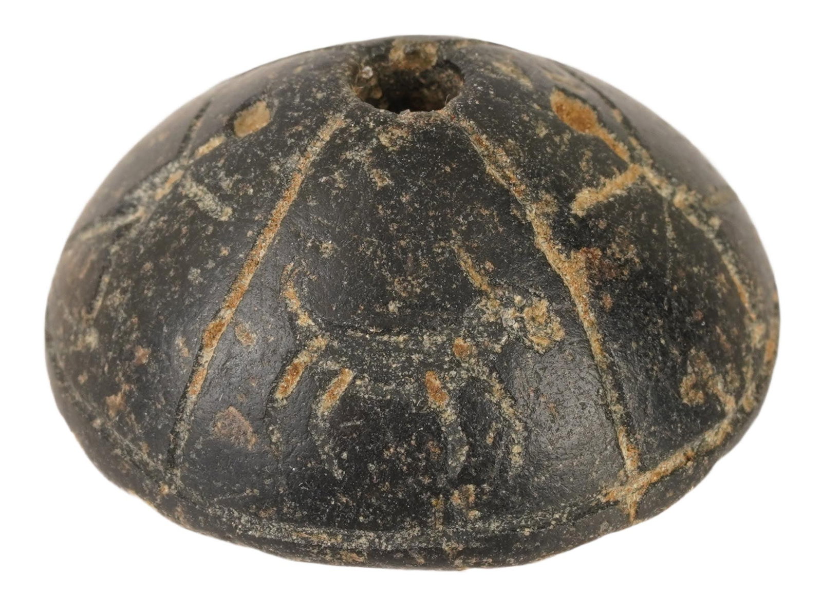 ANCIENT HELLENISTIC STEATITE SPINDLE WHORL WITH IMAGES: An ancient Hellenistic steatite spindle whorl, dating circa 300 to 100 BC. Engraved with animals and small figurative motifs. Such spindle whorls were functional tools used in spinning thread, while