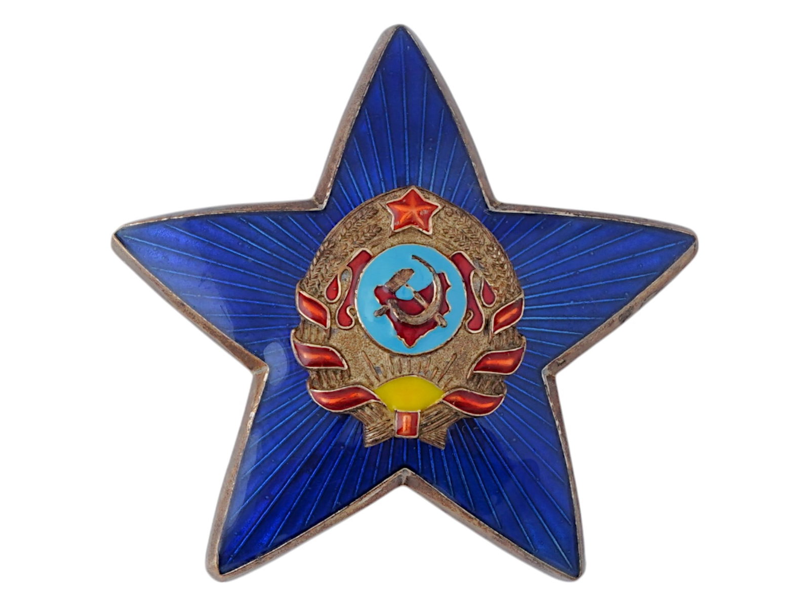 RUSSIAN SOVIET ENAMEL COCKADE POLICE CAP BADGE 1940S: A Russian Soviet enamel cockade police cap bronze badge, 1940s. The badge in the form of a blue enamel star with diverging rays. In the middle is a sickle and hammer in a wreath of wheat tied with a r