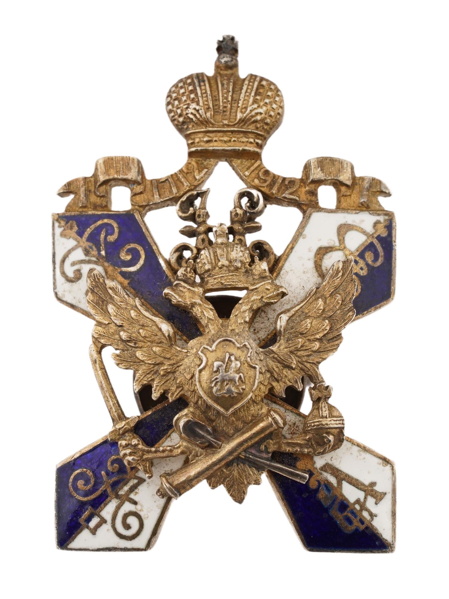 IMPERIAL RUSSIAN SILVER SECOND CADET CORPS BADGE: An Imperial Russian enameled gilt silver commemorative military badge, 200 Years of the Second Emperor Peter the Great Cadet Corps. Blue and white cross with Imperial eagle, crowned ribbon with dates 