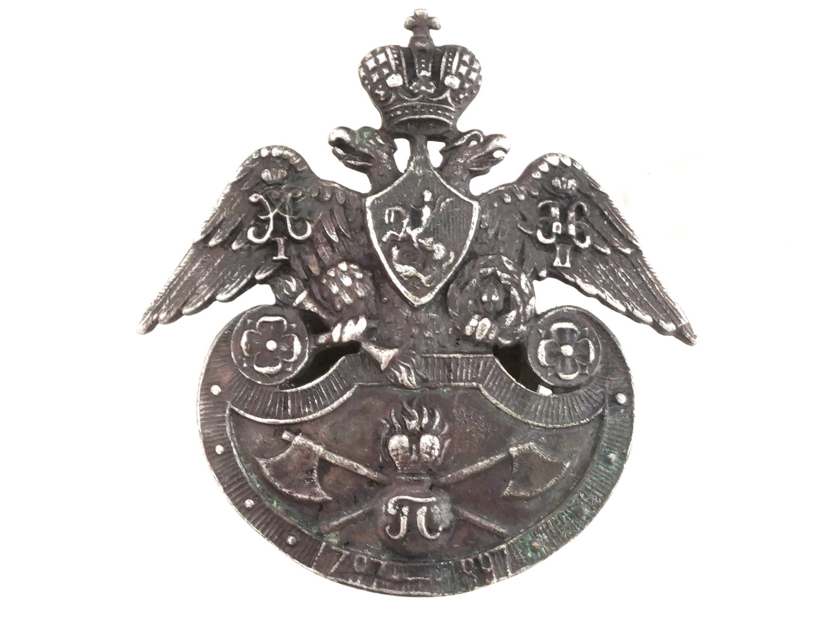 RUSSIAN IMPERIAL GRENADIER SAPPER BATTALION BADGE: A Russian Imperial bronze badge of the Grenadier Sapper Battalion of His Imperial Highness Grand Duke Peter Nikolayevich. The badge features a double-headed eagle resting on a shaped shield, crowned w