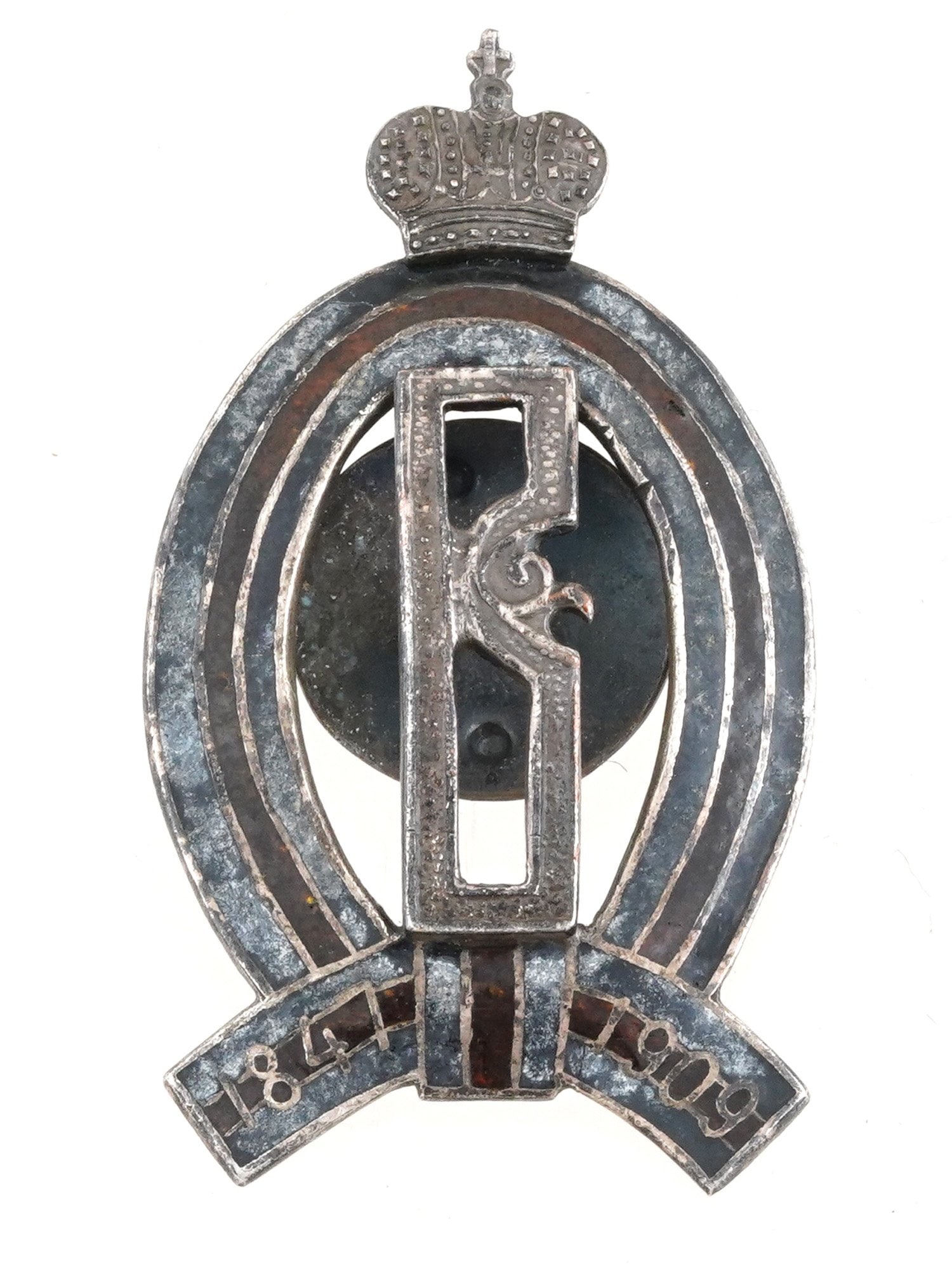 RUSSIAN IMPERIAL BADGE LEIB GUARD DRAGOON REGIMENT: A Russian Imperial bronze badge of the Leib-Guard Dragoon Regiment created in memory of the regiment's esteemed commander-in-chief, Grand Duke Vladimir Alexandrovich. Features his monogram framed by t