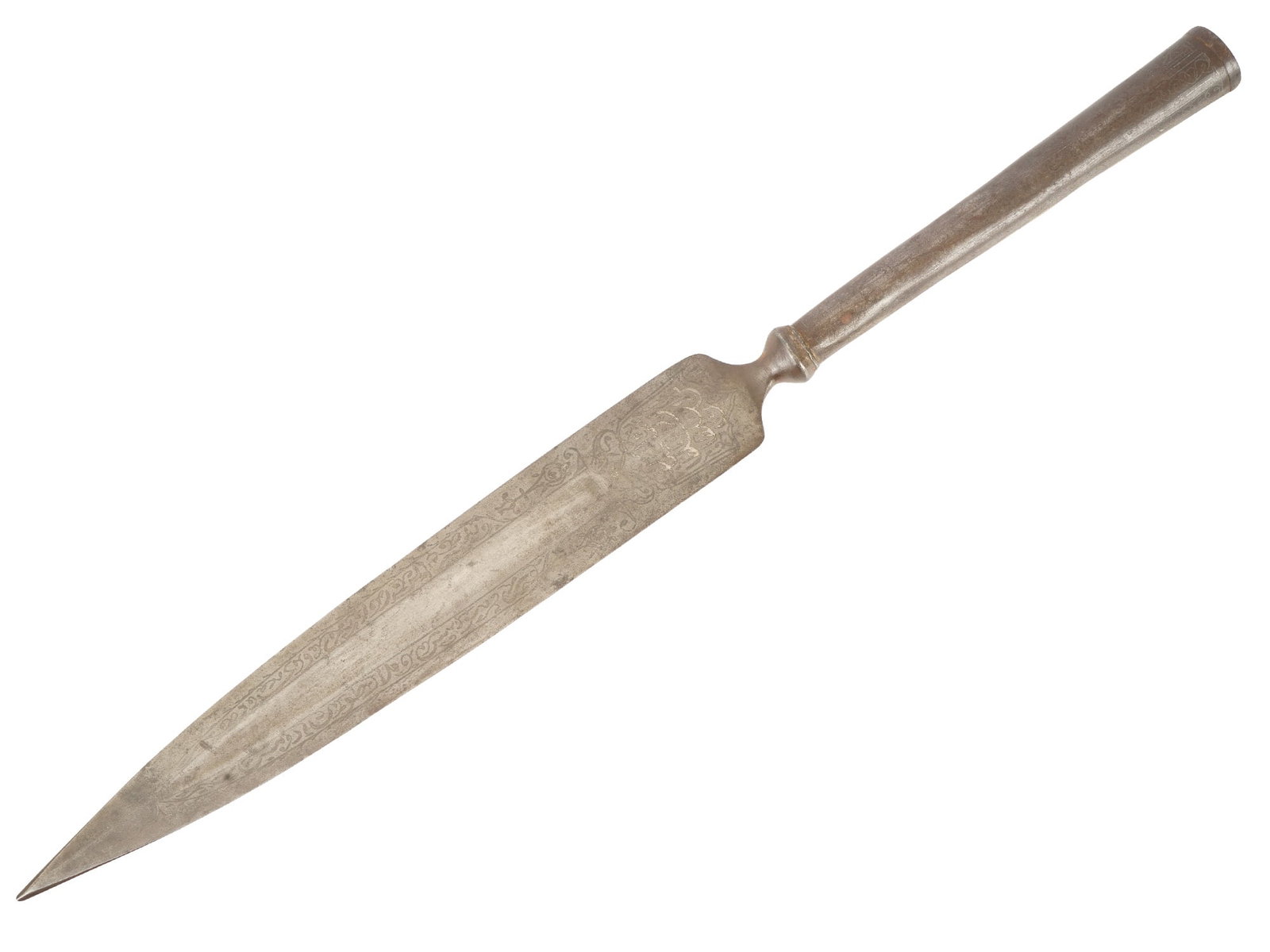 ANTIQUE PERSIAN QAJAR ENGRAVED SPEARHEAD: An antique Persian Qajar spearhead. The socketed iron spearhead features a broad, leaf-shaped blade tapering to a sharp point, characteristic of Middle Eastern weaponry. The blade faces are embellishe