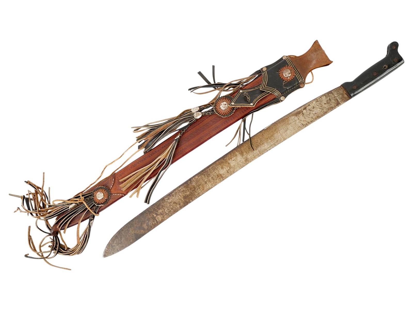 VINTAGE LATIN AMERICAN MACHETE WITH LEATHER SHEATH: A vintage machete. Stainless steel blade, black resin handle, unmarked. The piece comes in a brown leather sheath, decorated with tassels and ornamental stamps. Collectible Swords And Knives, Latin Am