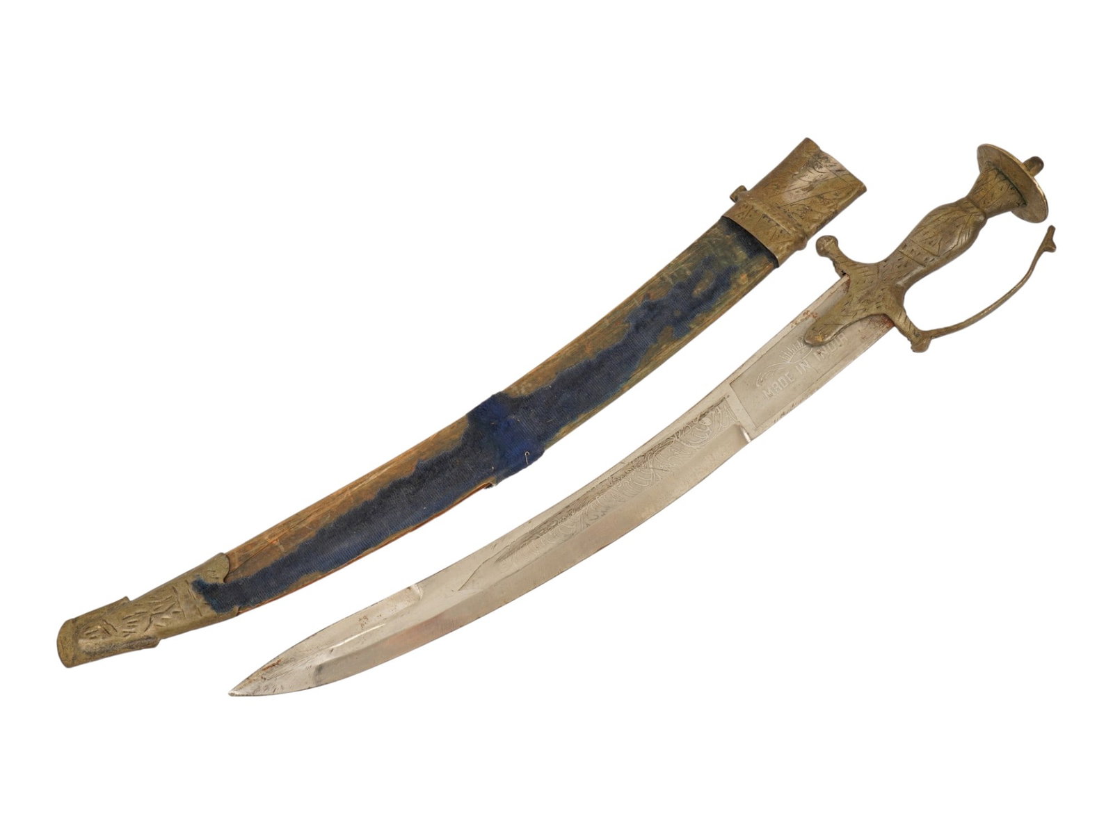 ANTIQUE INDIAN TALWAR SWORD WITH A CURVED STEEL BLADE: An antique Indian Talwar sword with a cast brass hilt and curved steel blade. The sword is accompanied by a blue velvet-covered scabbard with matching brass mounts. Marked. Antique Indian Swords And