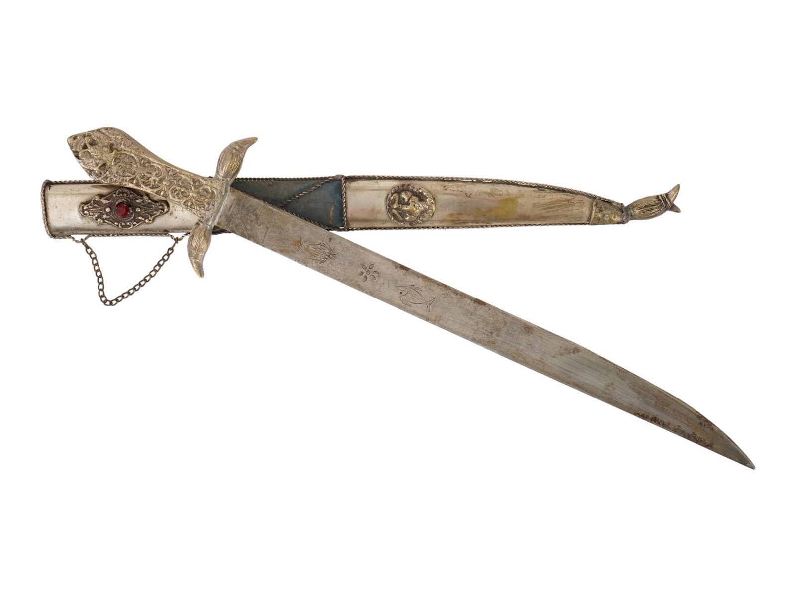 ANTIQUE GREEK TRADITIONAL DRESS DAGGER INDEPENDENCE WAR: An antique Greek traditional dress dagger commemorating the heritage of the Greek War of Independence. The dagger features a curved blade, an ornate cast-metal hilt, and a decorated scabbard with