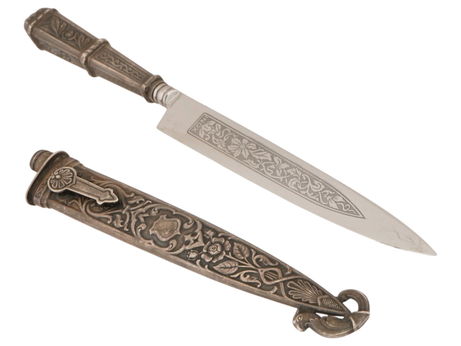 TRADITIONAL SOUTH AMERICAN GAUCHO KNIFE WITH A SHEATH: A traditional South American Gaucho knife, known as a Cuchillo Criollo or Facon, accompanied by its matching decorative sheath. The knife features a single-edged steel blade with etched foliate orname