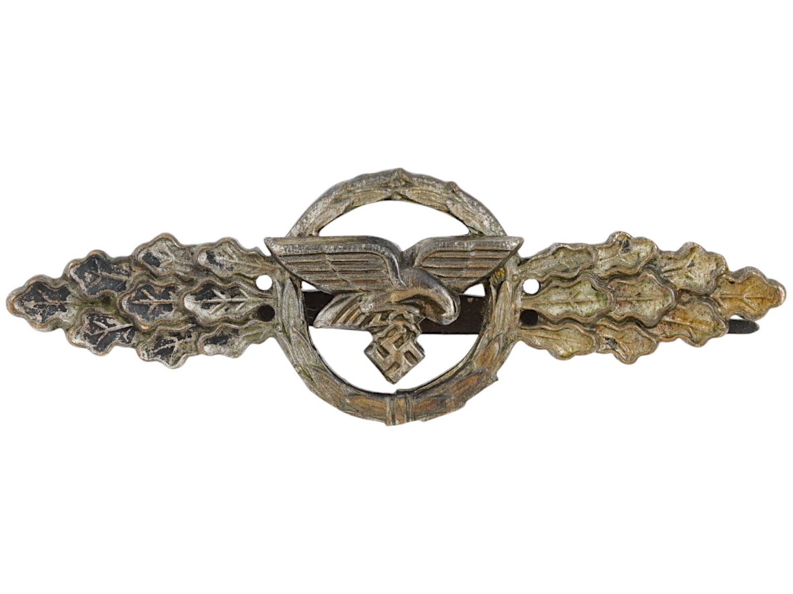WWII NAZI GERMAN LUFTWAFFE TRANSPORT AVIATION BADGE: A WWII Nazi German Third Reich Luftwaffe transport aviation badge. Featuring a German eagle clutching a swastika inside a laurel wreath. The badge is flanked by oak leaves on either side. Second World