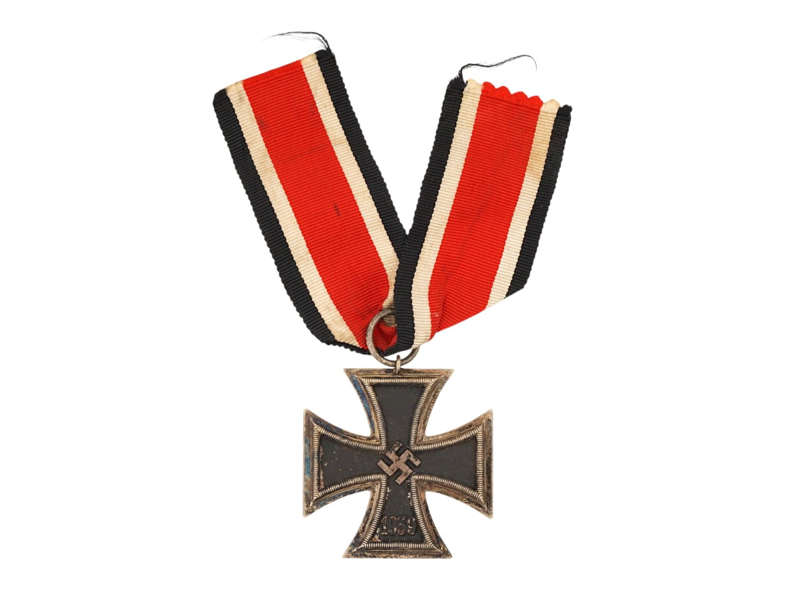 WWII NAZI GERMAN 1939 IRON CROSS SECOND CLASS MEDAL: A WWII Nazi German 1939 Iron Cross Second Class medal. Features the traditional cross pattee form with a blackened iron core, silver-toned ribbed border, central swastika, and the date 1939, suspended