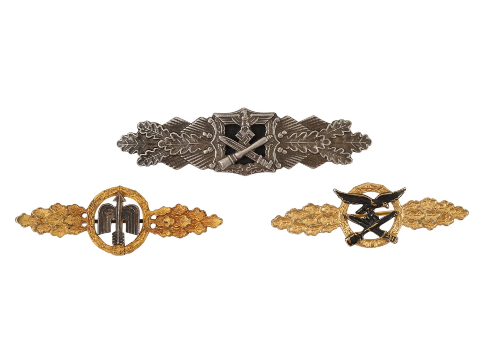 WWII NAZI GERMAN MILITARY CAMPAIGN AND COMBAT CLASPS: A World War II Nazi German military campaign and combat clasps, featuring the distinctive horizontal wing design with oak leaves used to recognize service and bravery. 1. Waffen-SS Close Combat Clasp.