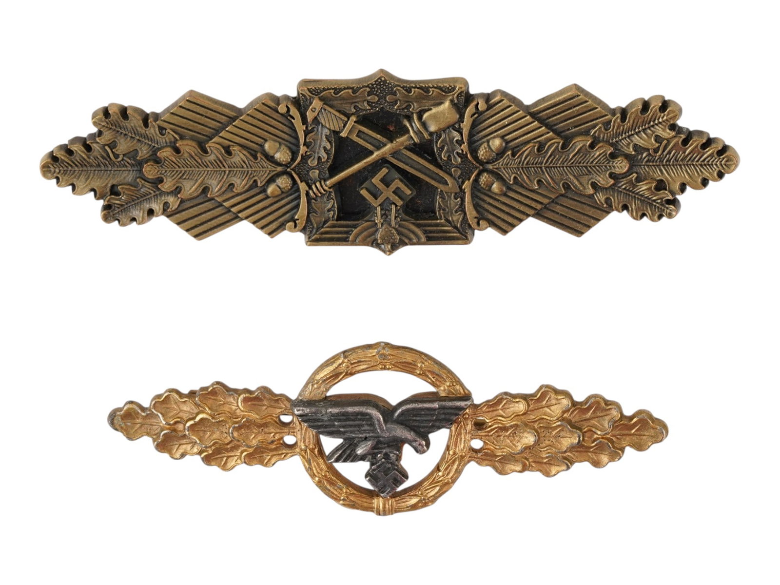 LOT OF TWO WWII NAZI GERMAN MILITARY BADGES: A lot of two WWII Nazi German military badges: Luftwaffe Front Flying Clasp for Transport and Heer Close Combat Clasp. 1. Close Combat clasp displays a central square panel featuring a crossed bayonet