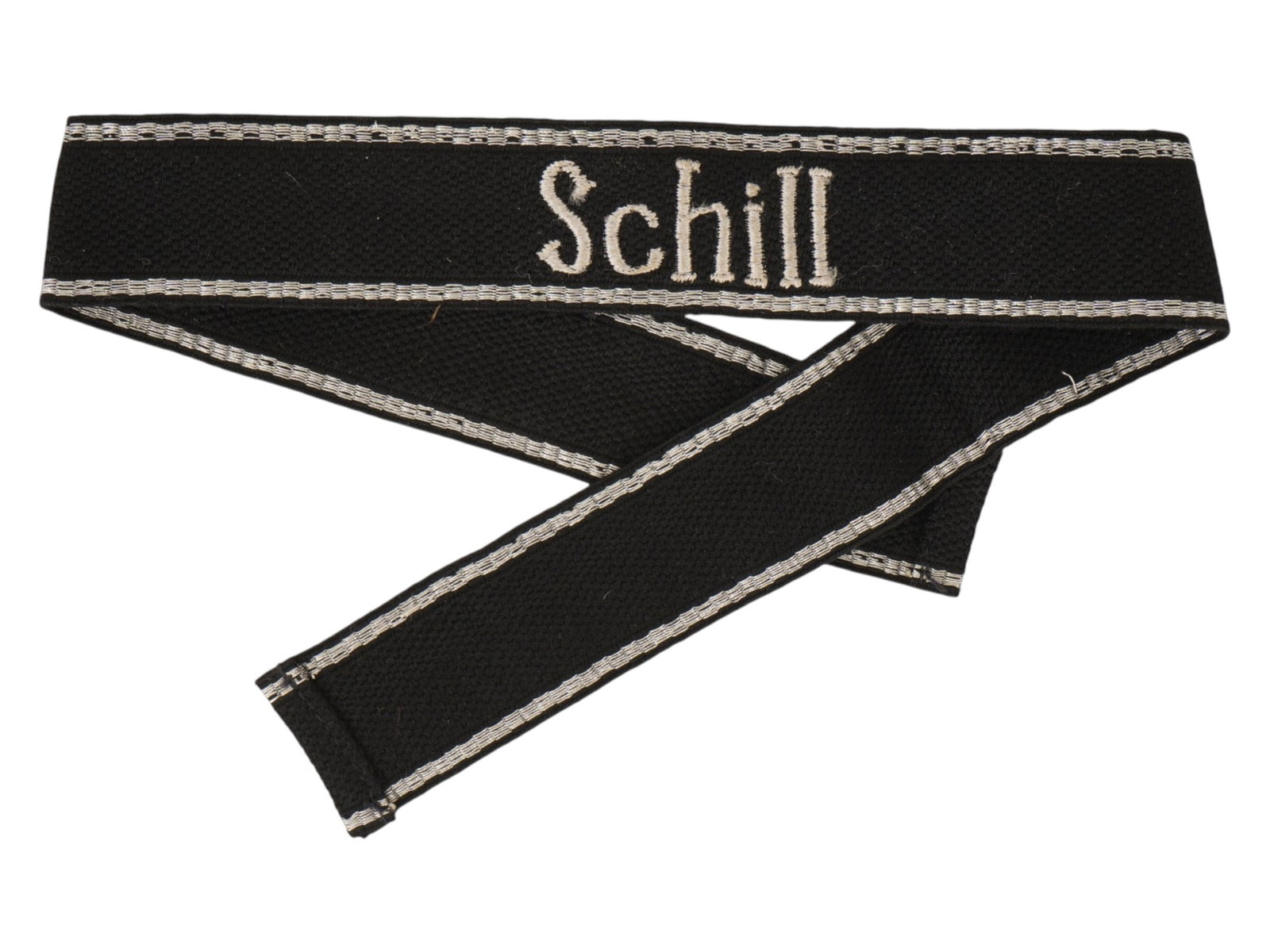 WORLD WAR II GERMAN MILITARY INSIGNIA SCHILL CUFF TITLE: A World War II German Schill cuff title, a military insignia. This cuff title was worn by members of the SS-Freiwilligen-Grenadier-Division Schill, a combat unit formed in late 1944. The division was 