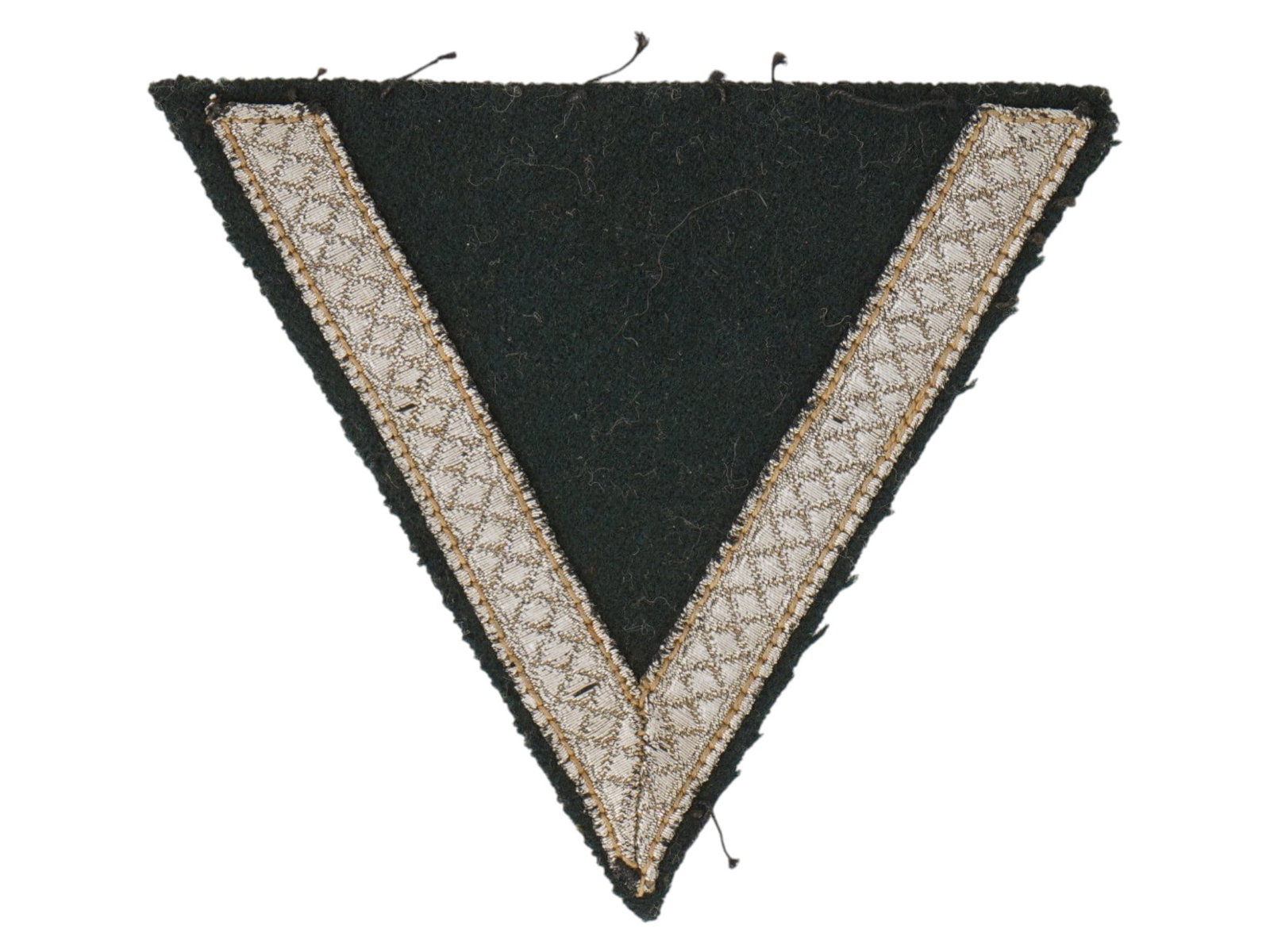 WWII SLEEVE CHEVRON OF CORPORAL OF THE GERMAN ARMY: A sleeve chevron of a corporal Gefreiter of the German Army Heer or Luftwaffe during World War II. It is made in the form of an inverted triangle from dark green cloth, onto which one V shaped element