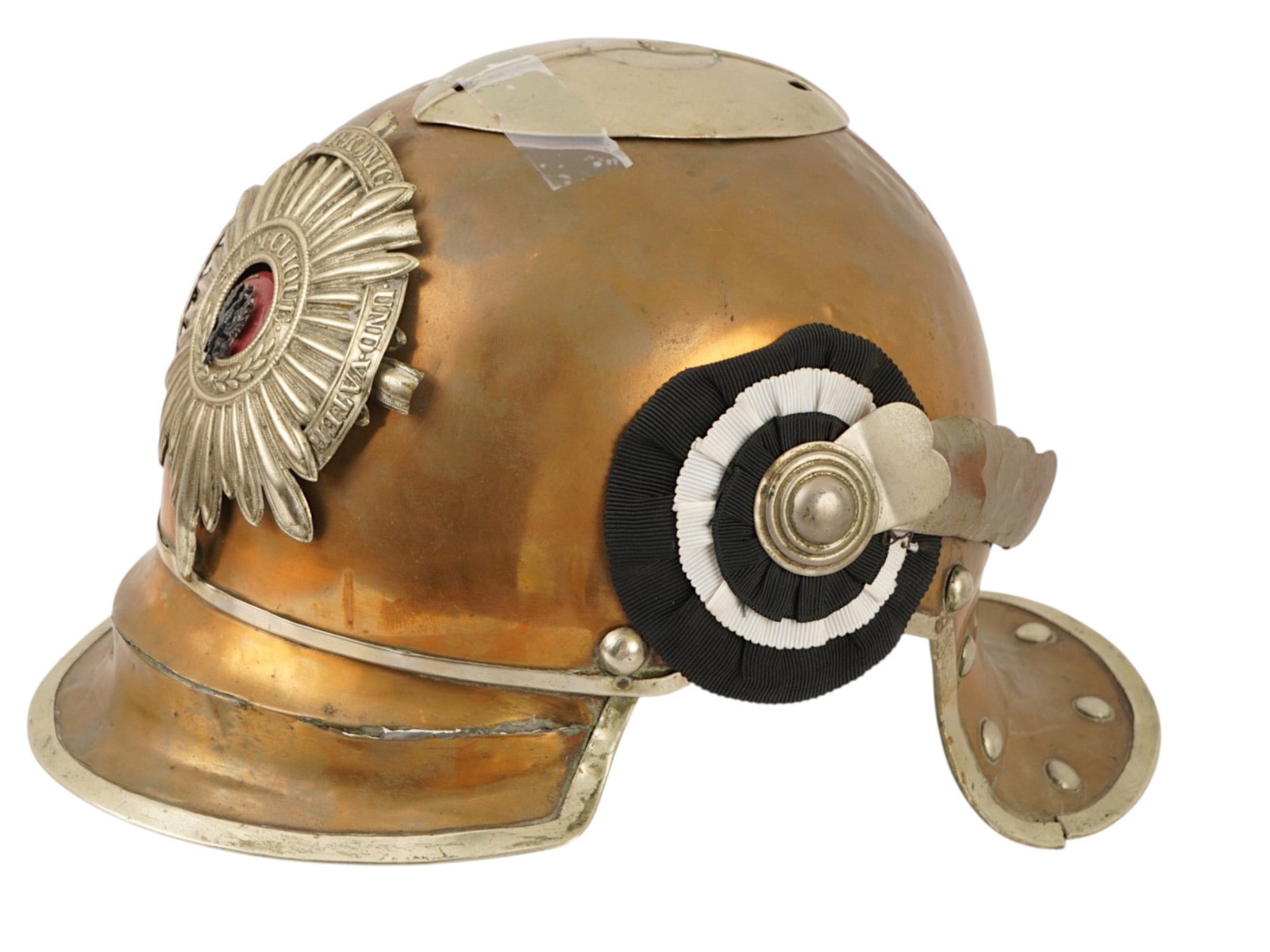 ANTIQUE CEREMONIAL HELMET OF A PRUSSIAN SOLDIER: An antique ceremonial helmet of a Prussian soldier, model of 1860s. It is made of brass tombac with a nickel silver edging and decorated with a characteristic guard star with the inscription With God,