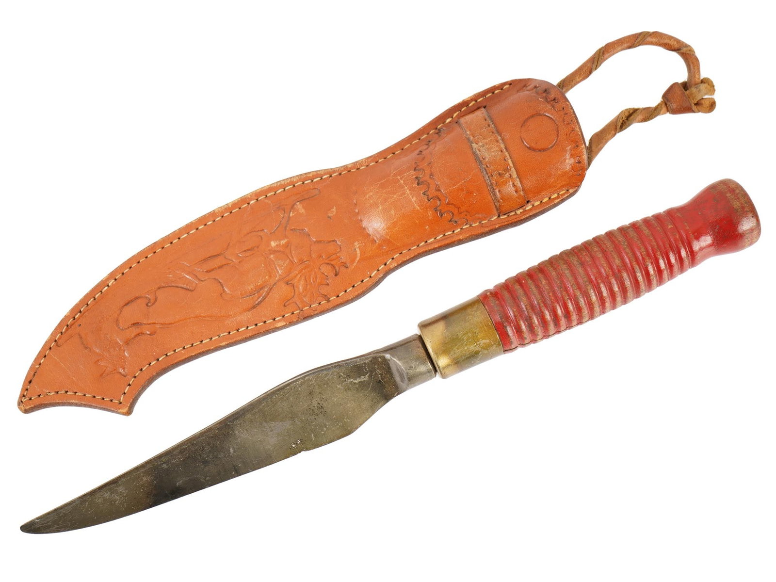 VINTAGE FINNISH PUUKKO KNIFE WITH A LEATHER SHEATH: A vintage Finnish puukko knife, a traditional Nordic utility tool known for its clean, straight-back carbon steel blade and refined handcraftsmanship. The knife features a red-stained wooden handle wi
