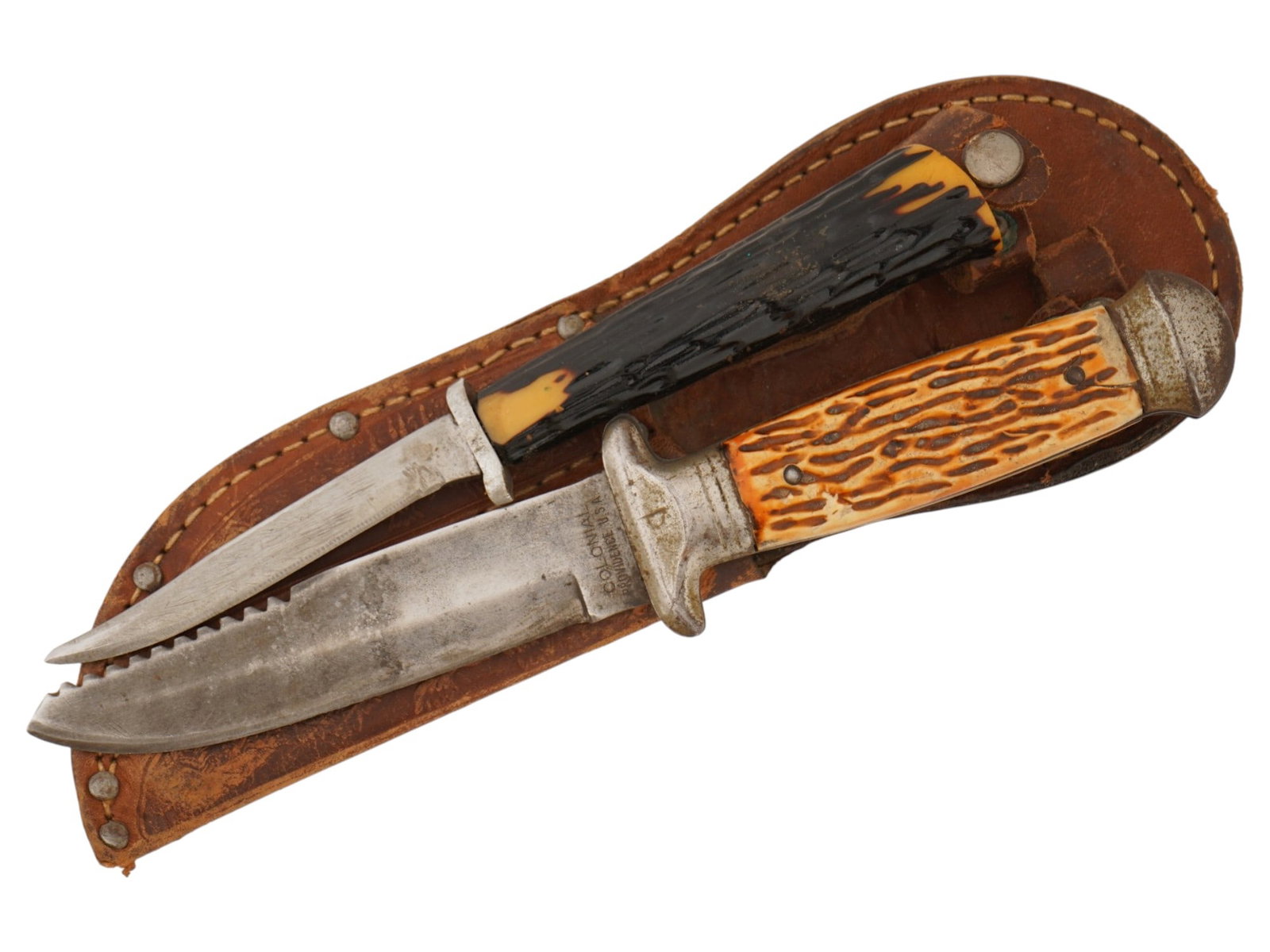 LOT OF TWO VINTAGE AMERICAN HUNTING KNIFES: A lot of two vintage hunting knifes including a colonial providence USA dual hunting knife and a secondary skinning knife, housed together in a custom-fitted dual leather tandem sheath. One knife is m