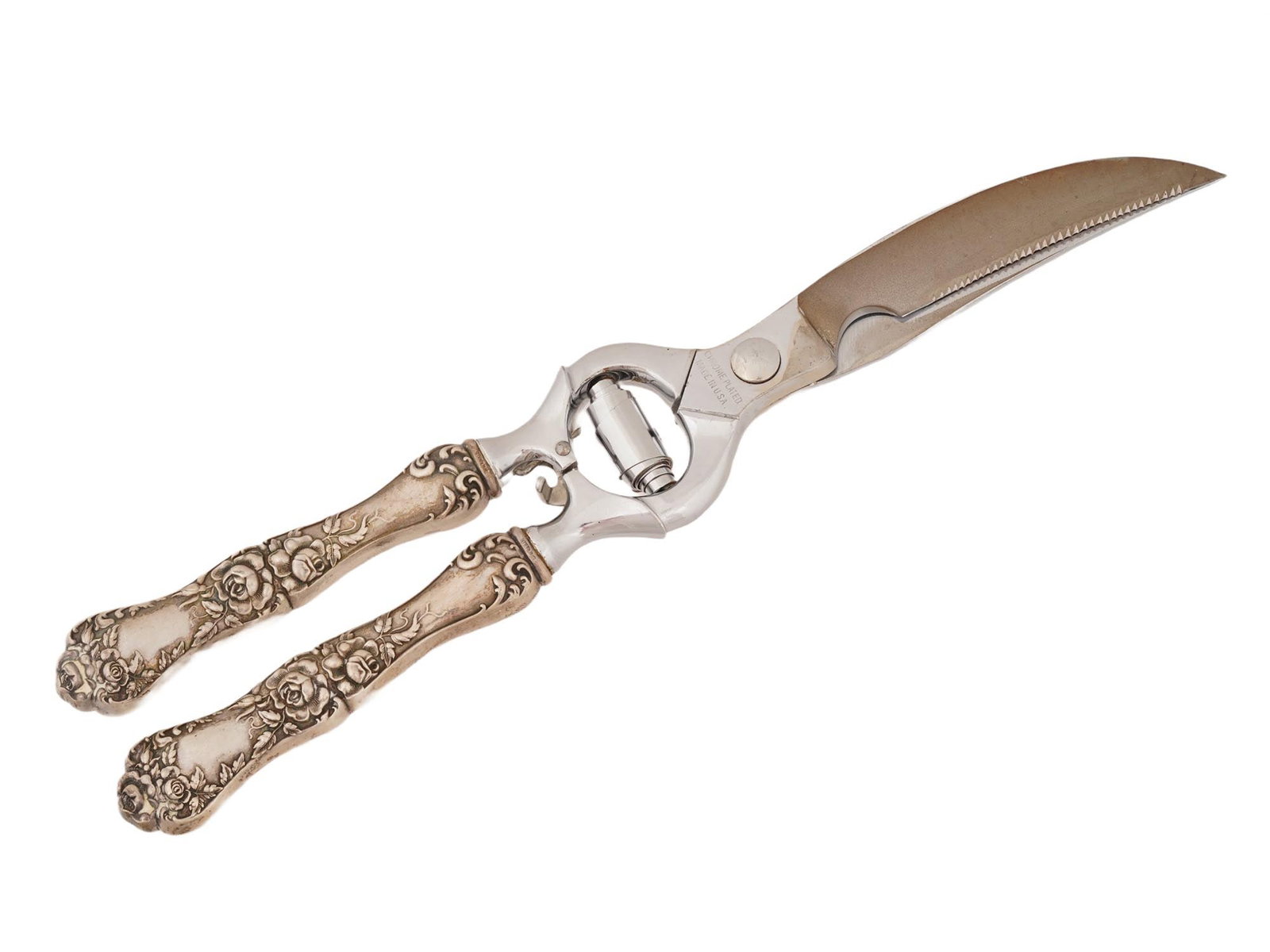 VINTAGE AMERICAN POULTRY SHEARS WITH SILVER HANDLES: Vintage American poultry shears fitted with sterling silver handles, combining functional kitchen utility with decorative craftsmanship. The handles display detailed repousse-style ornamentation,
