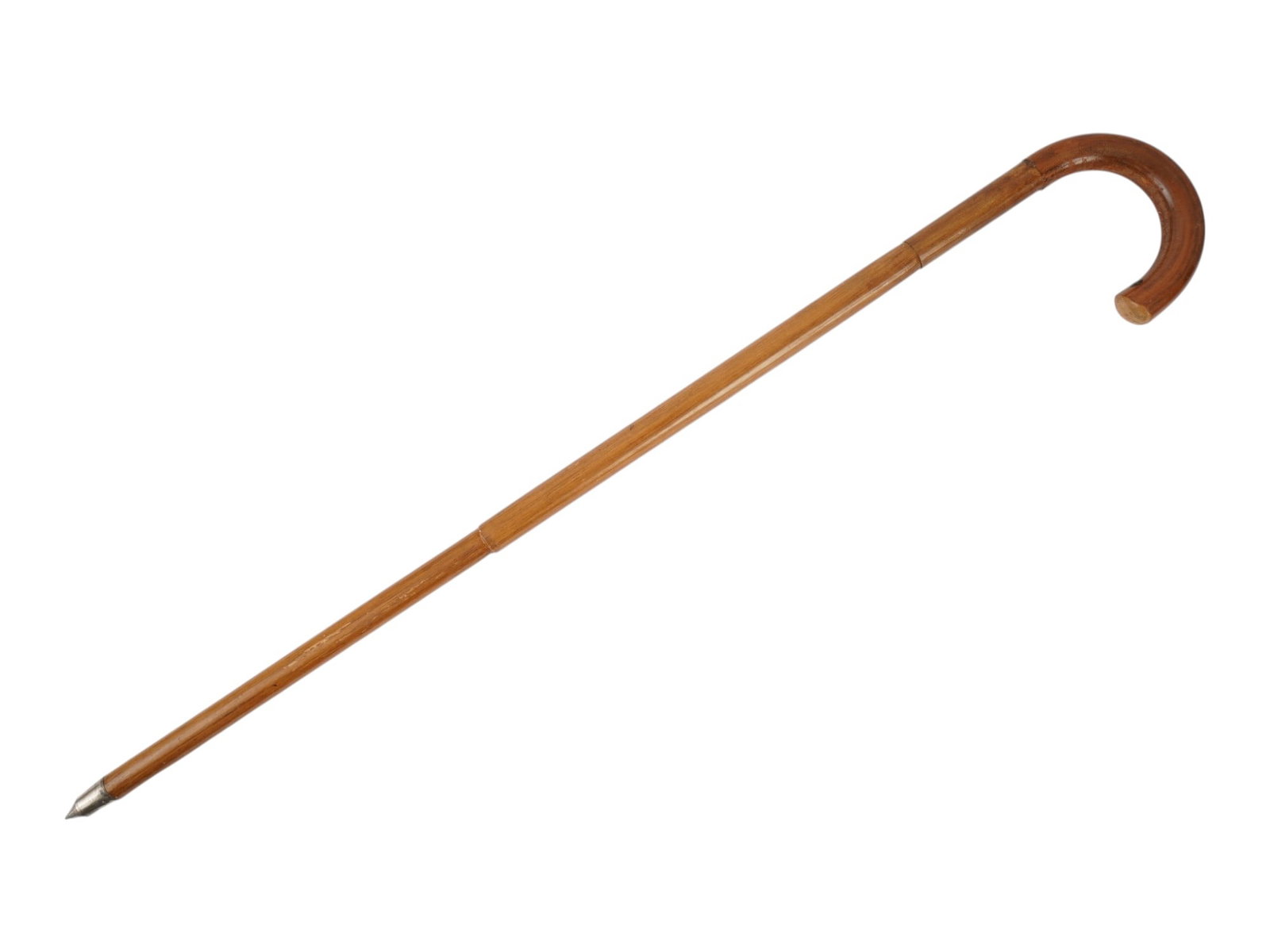 WOODEN WALKING CANE W CROOK HANDLE AND METAL FERRULE: A vintage walking cane features a traditional crook handle crafted from a single piece of steam-bent wood with a visible natural grain throughout. The shaft tapers toward the base, which is fitted wit