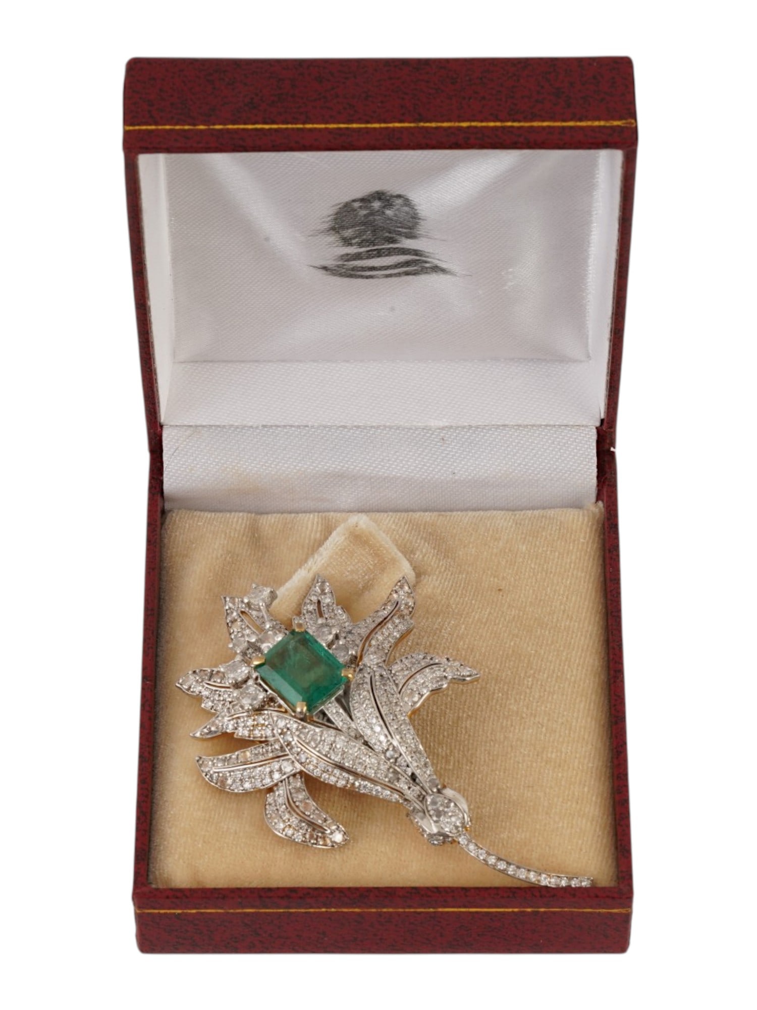 RUSSIAN GOLD SILVER DIAMOND EMERALD FLOWER BROOCH: A Russian gold and silver pin brooch representing a flower. The piece is richly garnished with diamonds and is set with a large octagon-cut emerald in the center of the bud. Hallmark of 56 gold standa