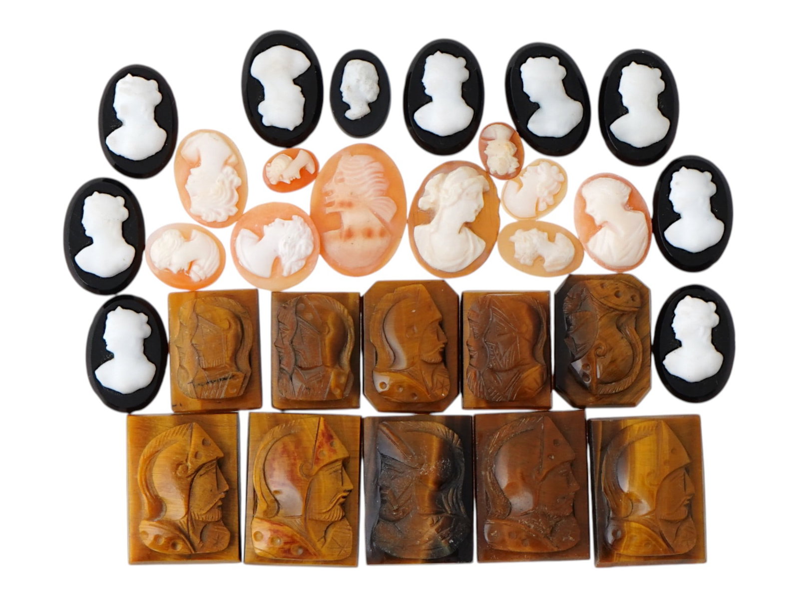 COLLECTION OF ANTIQUE HAND CARVED CAMEOS: A collection of antique hand carved cameos, dating to the late 19th to early 20th century. A total of 30 items. Each piece is crafted from conch shell and stone, featuring knights in armor and female