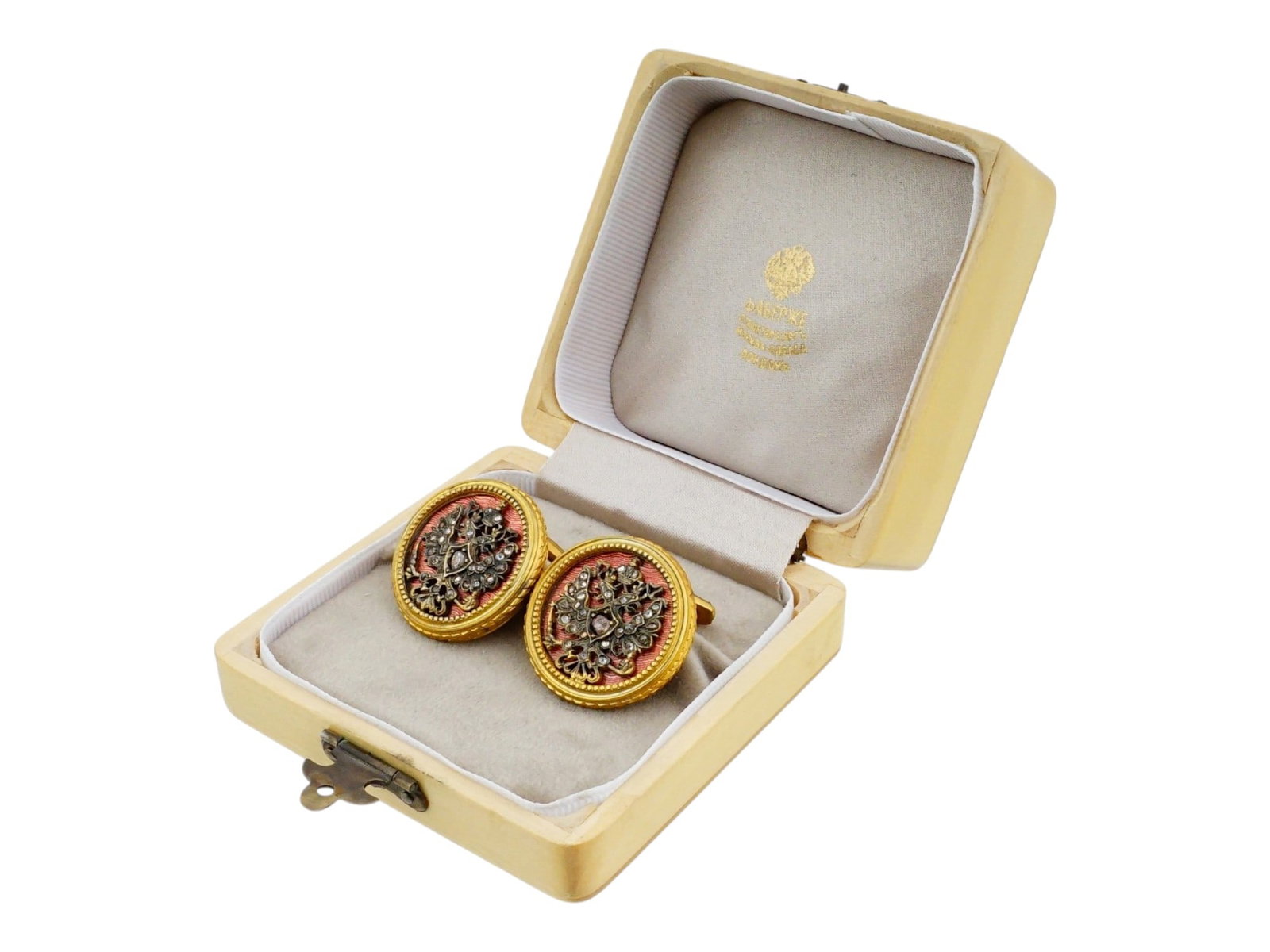 PAIR OF RUSSIAN EAGLE SILVER ENAMEL DIAMOND CUFFLINKS: A pair of Russian style cufflinks, each of circular form, crafted in silver gilt with a translucent red guilloche enamel ground. The center of each cufflink is applied with an Imperial double headed e
