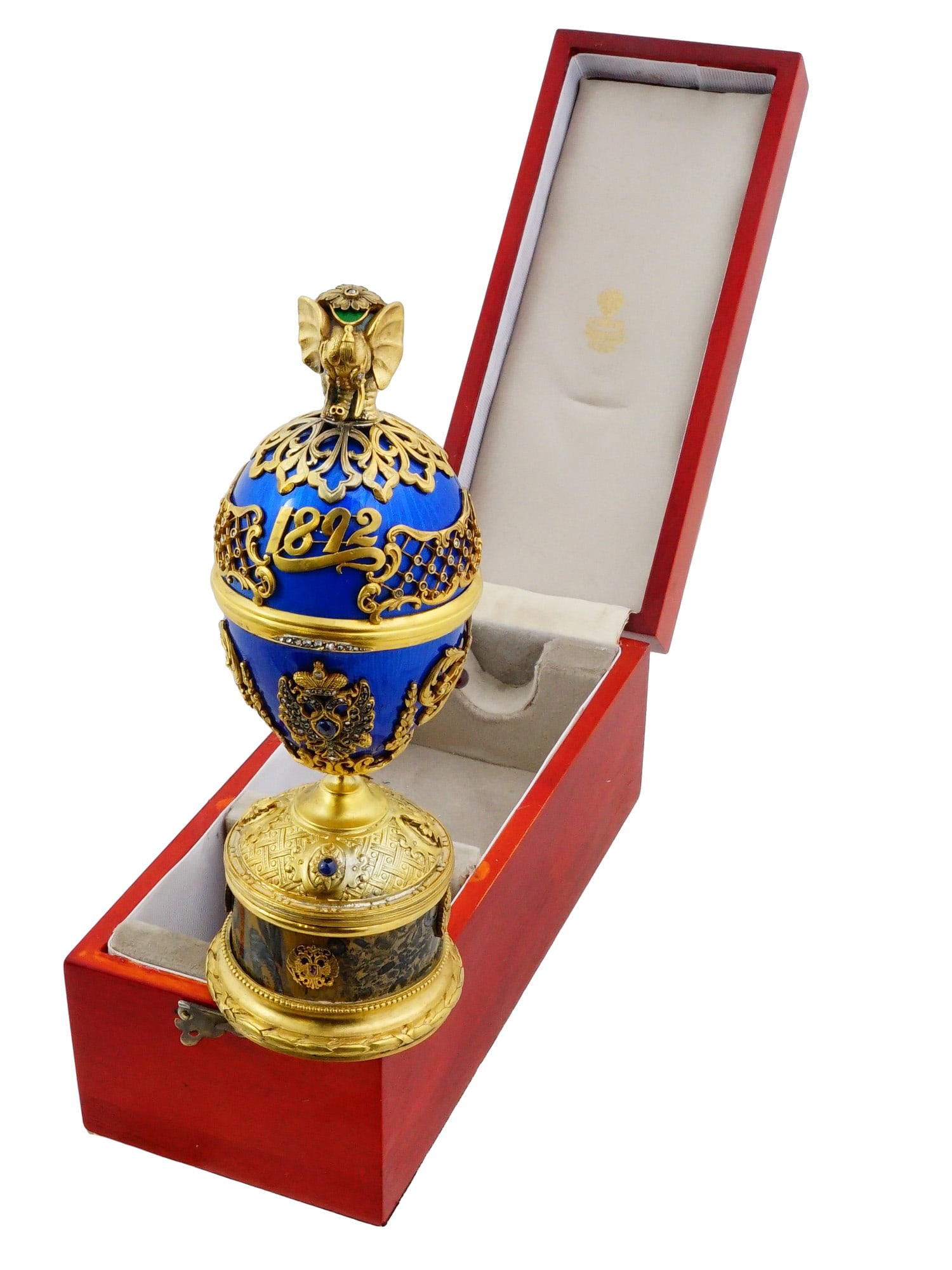 RUSSIAN SILVER ENAMEL EASTER EGG SURPRISE TRINKET BOX: A Russian silver enamel Easter egg trinket box featuring a hidden surprise in the form of a detailed gilt French Bulldog figurine mounted on a circular pedestal. The cobalt-blue guilloche enamel body 