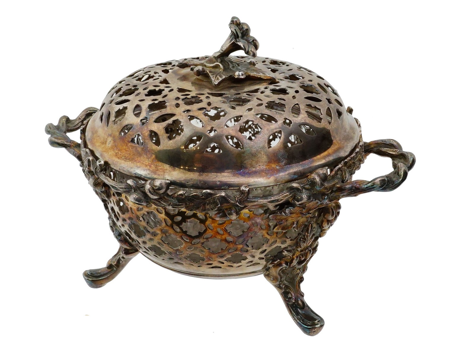 ANTIQUE CHRISTOFLE FRENCH SILVER PLATED SUGAR BOWL: An antique late 19th-century silver-plated lidded sugar bowl, attributed to Christofle. Tripod piece with side handles. Elaborate pierced and sculpted floral decoration. The item comes with a carved g