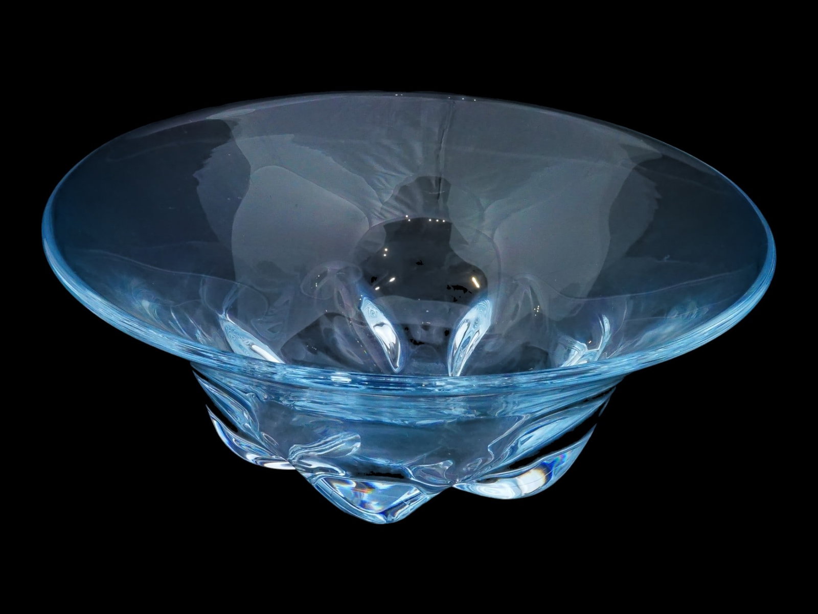 1960S ORREFORS SWEDEN BLUE GLASS FRUIT BOWL: A mid-century glass fruit bowl by Orrefors, a Swedish brand established in 1898. Ca. 1960s. Design by Edward Hald, 1883 to 1980. Transparent blue glass. Modernist taper shape, six bulbous feet. Etched