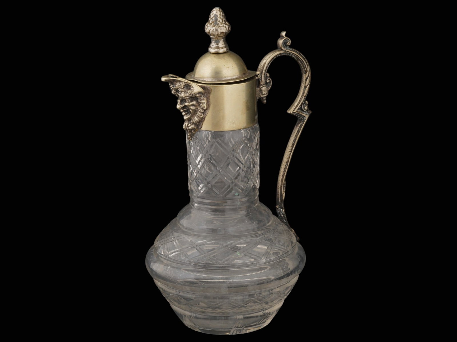 ANTIQUE CUT GLASS EPNS NICKEL SILVER WINE DECANTER: An antique cut-glass claret jug or wine decanter. The vessel features a glass diamond-cut pattern. The neck, lid, and handle are made of Electro-Plated Nickel Silver. The hinged lid topped with a cone