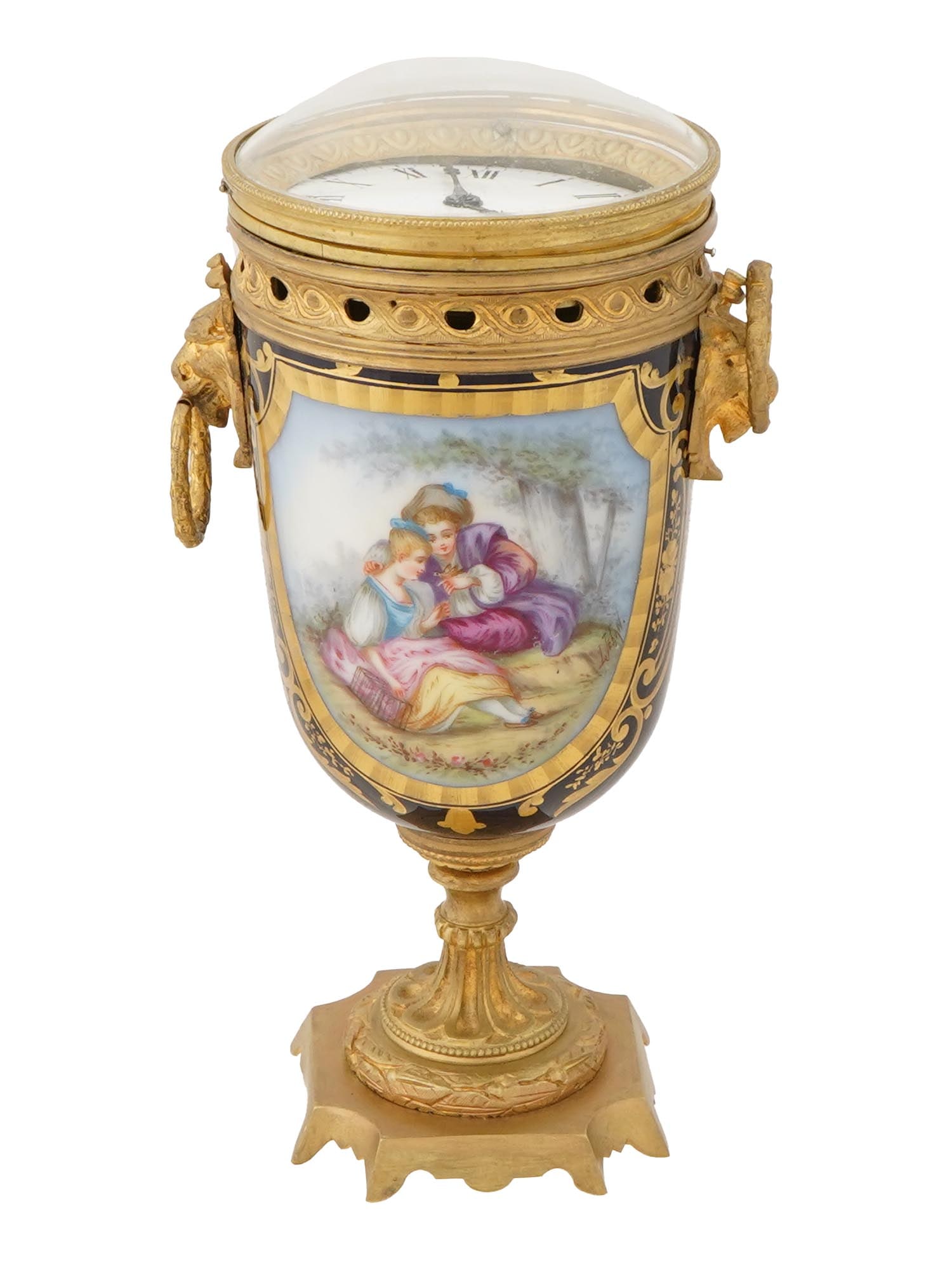 19TH C AUSTRIAN PAINTED PORCELAIN BRONZE TABLE CLOCK: A 19th century Austrian Vienna hand painted and gold patinated bronze table clock with a platform escapement movement. The clock is made in a vase design and decorated with hand painted medallions