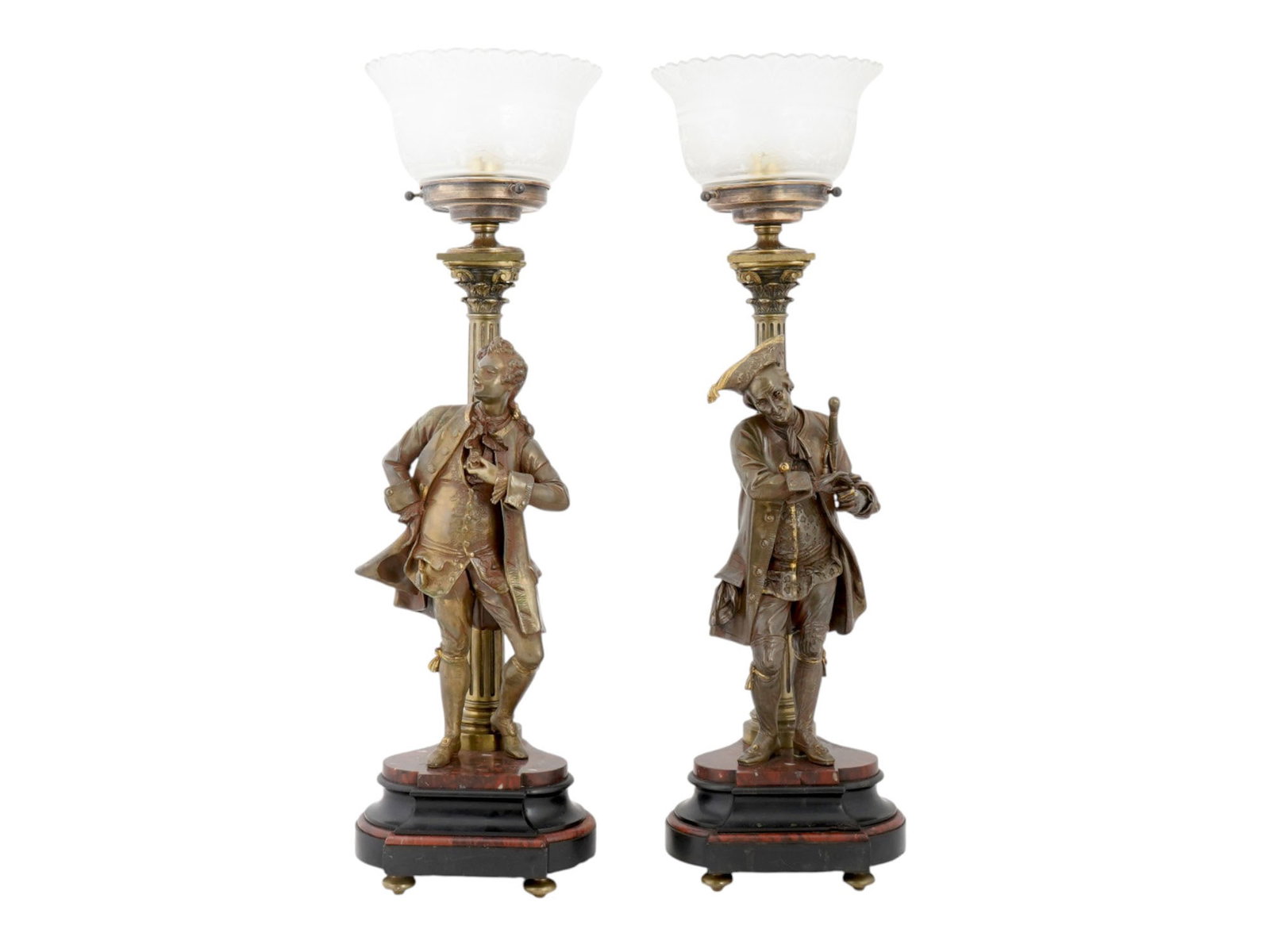 ANTIQUE BRONZE AND MARBLE FIGURAL TABLE LAMPS: A pair of antique early 20th century gilt cast bronze figural table lamps. Mounted on French black and rouge marble bases. The shafts are designed as a Corinthian column, complemented by male figures