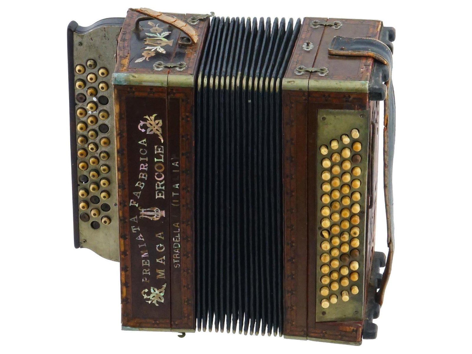 ANTIQUE ITALIAN ACCORDION BY MAGA ERCOLE C 1895: An antique accordion by Maga Ercole, created circa 1895 in Stradella, Italy. Made of wood with leather straps and raised right and left keyboard buttons. Has handles for carrying. Decorated with marqu