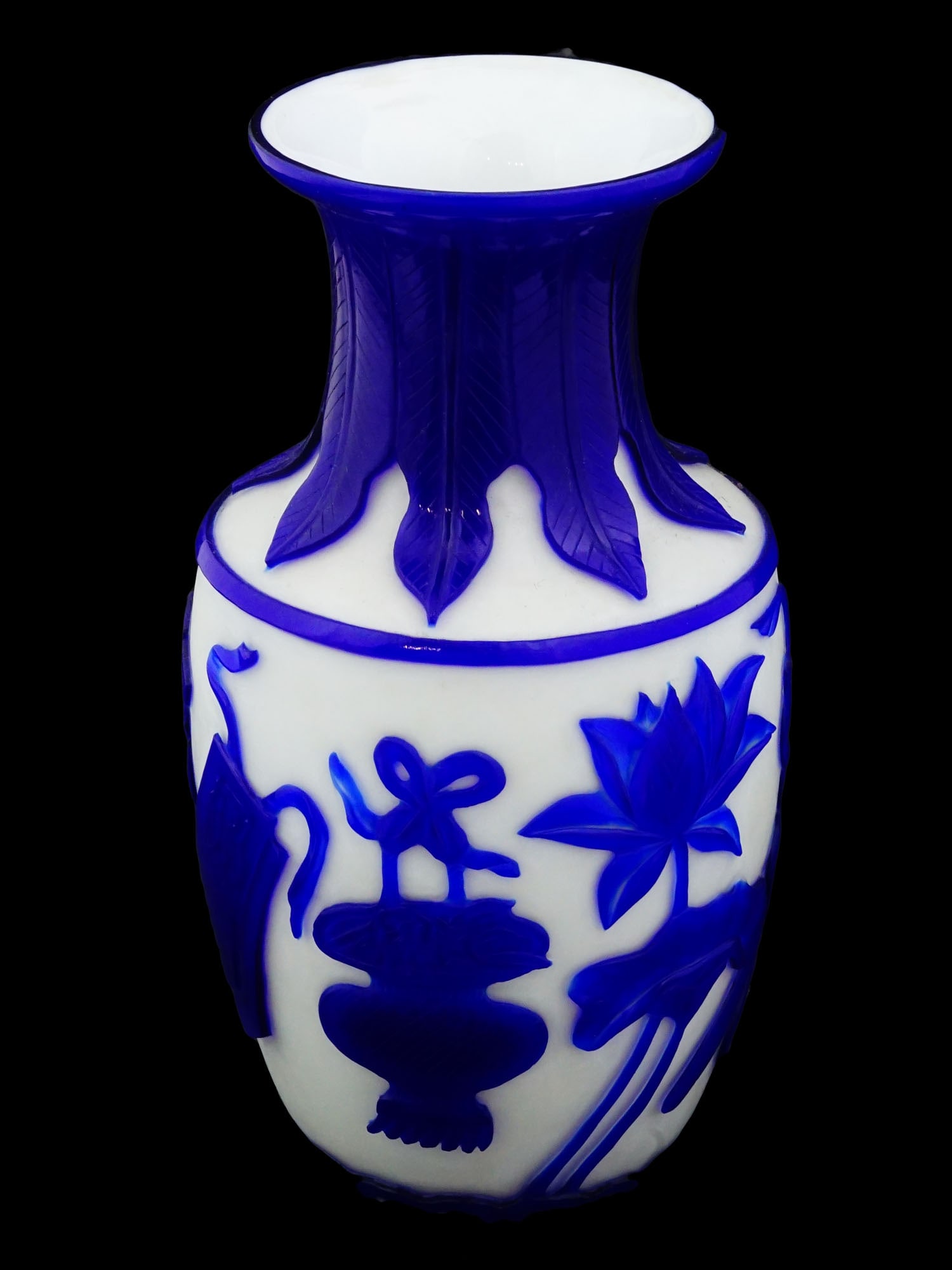 CHINESE BEIJING GLASS BLUE AND WHITE VASE: A Chinese blue and white vase made using the Beijing glass technique with an applied blue pattern on a white background. The traditional shaped vase with a wide body and a tapered neck that widens tow