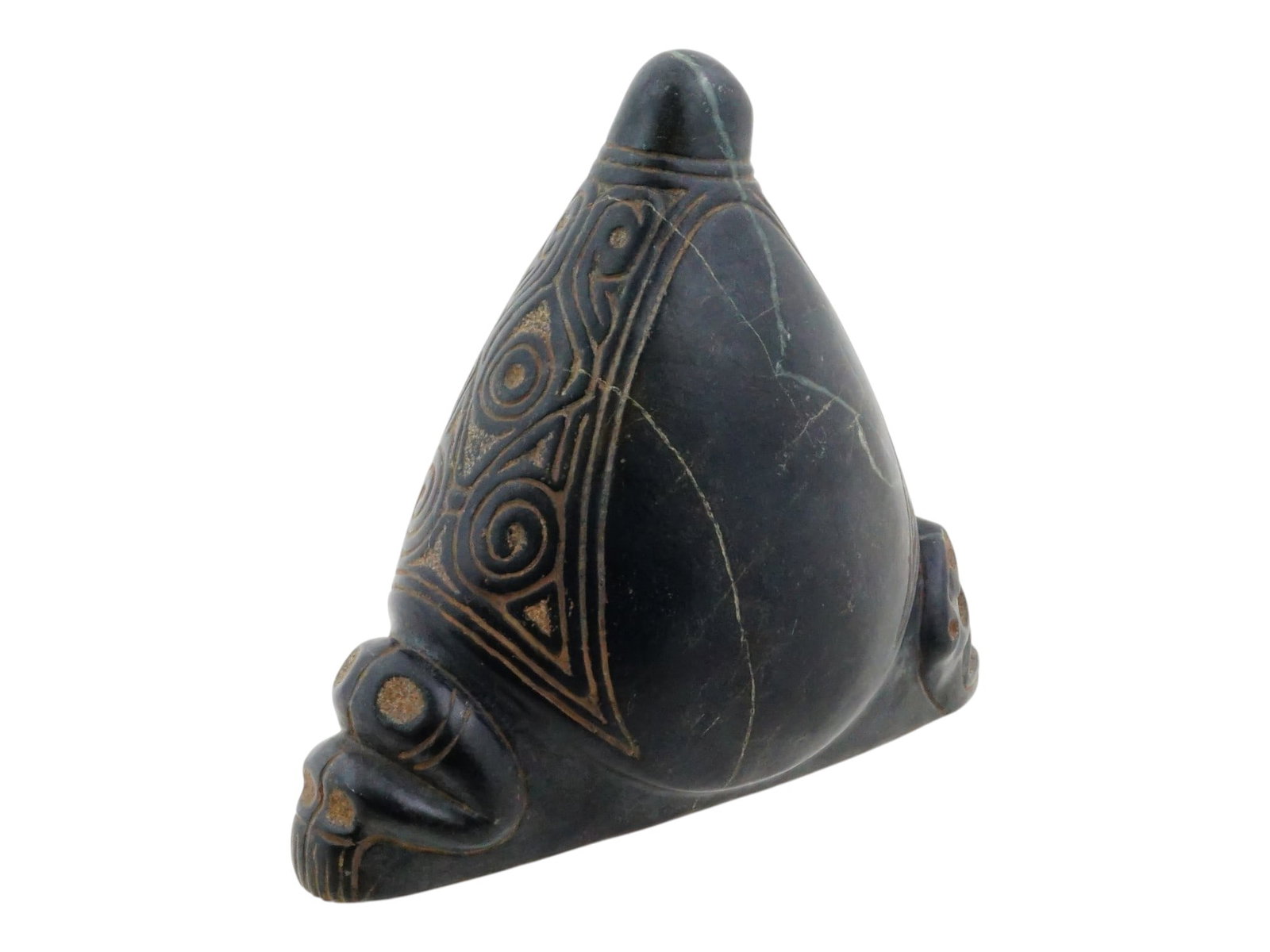 ANCIENT PRE COLUMBIAN HARD STONE TAINO ZEMI FIGURINE: A Pre Columbian, Hispaniola, Greater Antilles Islands, Taino stone zemi figurine. A remarkably well preserved stone zemi figure presenting in a traditional 3 pointed form known as a trigonolith with a