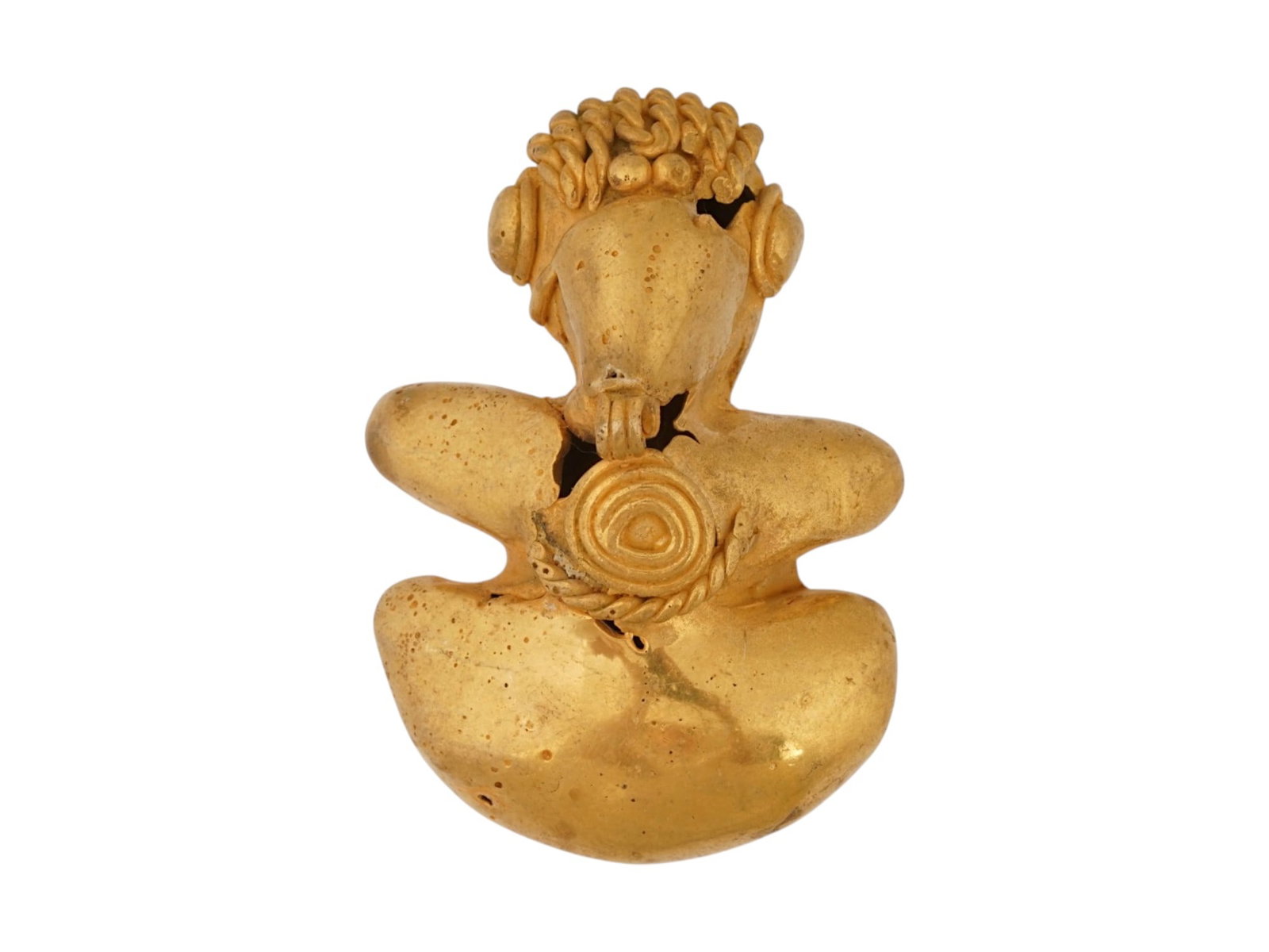 ANCIENT PRE COLOMBIAN TUMBAGA BIRD FIGURAL PENDANT: An ancient Pre Columbian Tairona Tumbaga figural pendant. Tumbaga, an alloy of gold and copper, showcases the metallurgical proficiency of Pre Columbian Mesoamerican civilizations. The piece is shaped