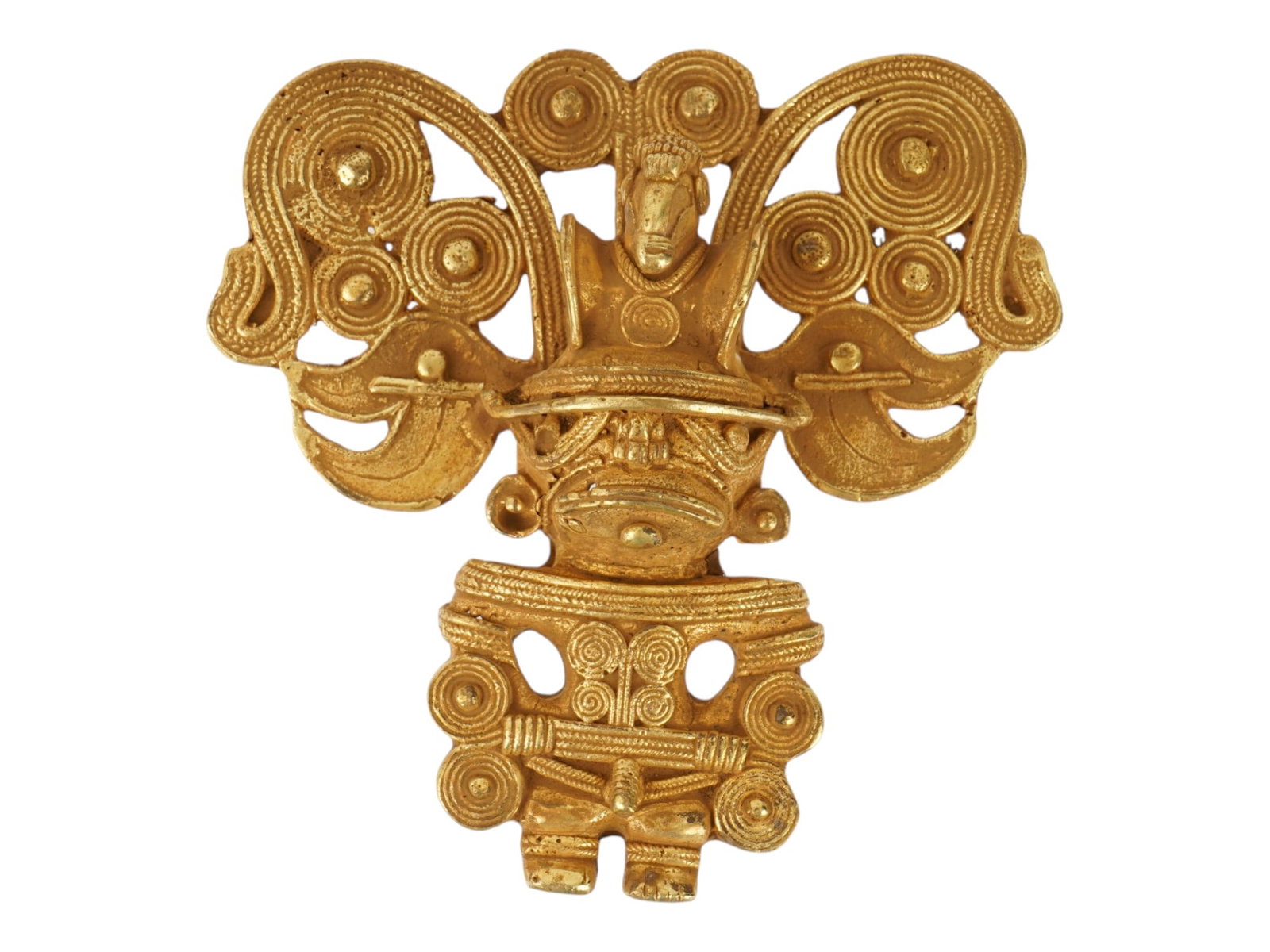 PRE COLUMBIAN TAIRONA TUMBAGA MALE FIGURE PENDANT: An ancient Pre Columbian Tairona tumbaga pendant. Tumbaga, an alloy of gold and copper, showcases the metallurgical proficiency of Pre Columbian Mesoamerican civilizations. The piece is shaped as a ma