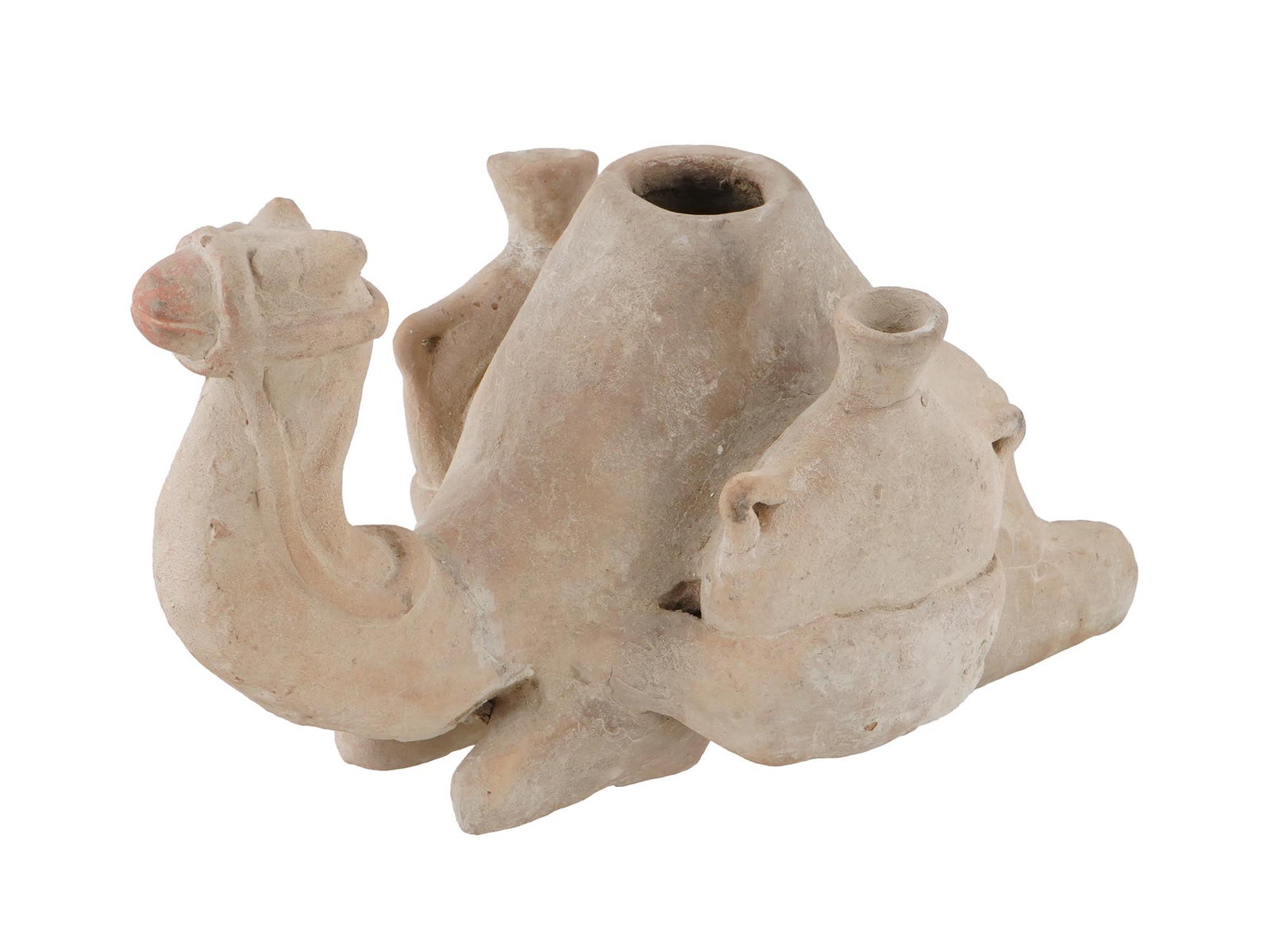 ANCIENT STYLE TERRACOTTA OIL LAMP IN THE SHAPE OF CAMEL: An ancient style terracotta oil lamp in the shape of a camel. The lamp is made of unglazed terracotta and has a light, earthy color. It is designed with the camel's body holding two jugs. Ancient Hist