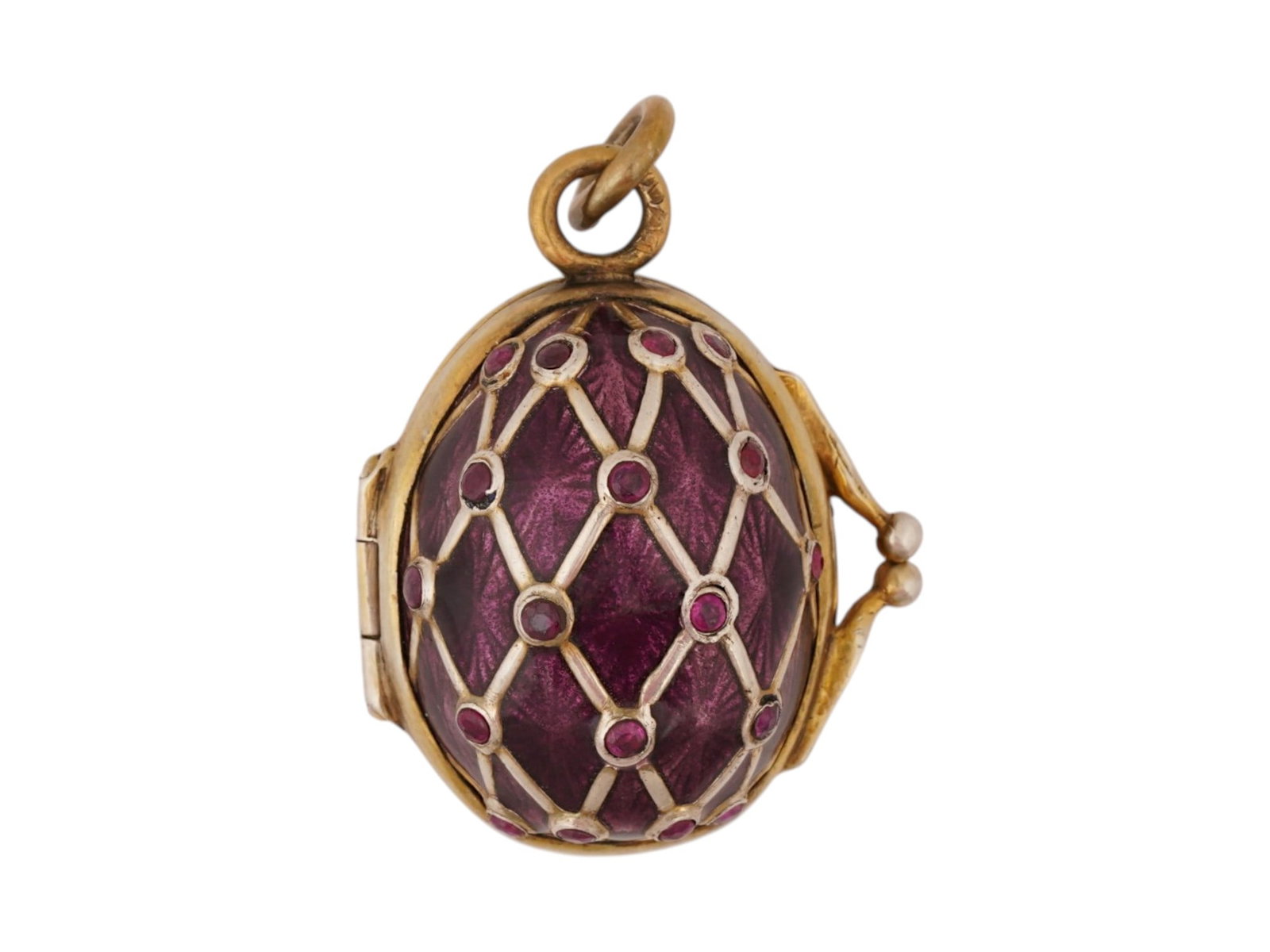 RUSSIAN SILVER ENAMEL EGG LOCKET PENDANT W RUBIES: A Russian gilt silver guilloche enamel Easter egg locket pendant. The surface is covered with purple enamel and gilt lozenge overlay garnished with natural ruby cabochons. Hallmarked with 88 silver st