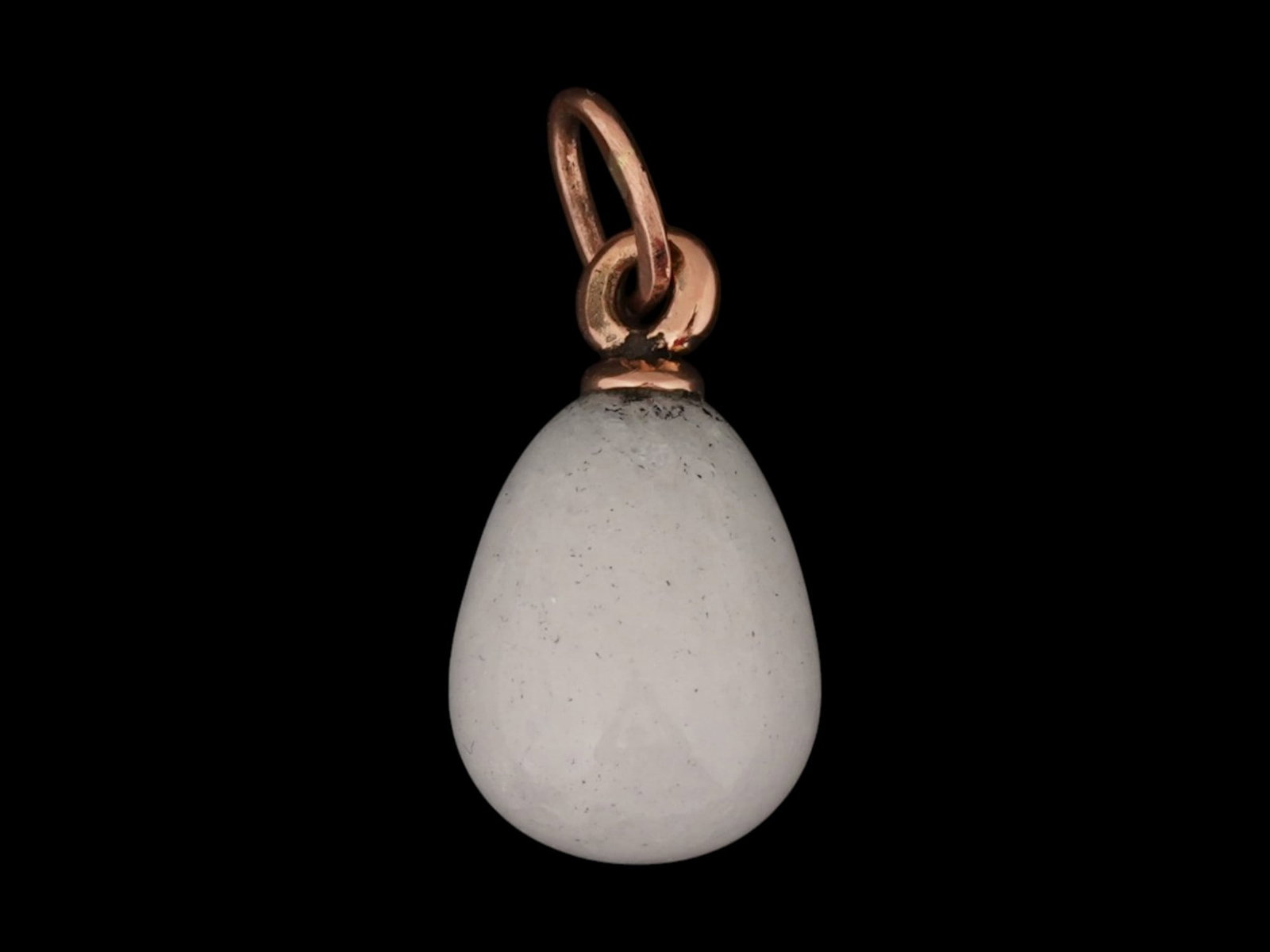 RUSSIAN 14K GOLD CARVED WHITE JADE EASTER EGG PENDANT: A Russian carved white jade Easter egg pendant with 14K pink Gold fittings. Hallmarked with the 56 Russian gold proof for 14K and a makers mark, on the suspension ring. Collectible Russian Jewelry And