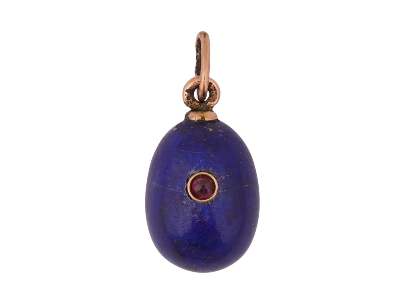 RUSSIAN 14K GOLD LAPIS LAZULI EASTER EGG PENDANT W RUBY: A Russian hand carved Lapis Lazuli Easter egg pendant. The pendant is encrusted with a round cut Ruby stone in a gold setting to the center. Marked on the suspension ring with 56 Imperial gold standar