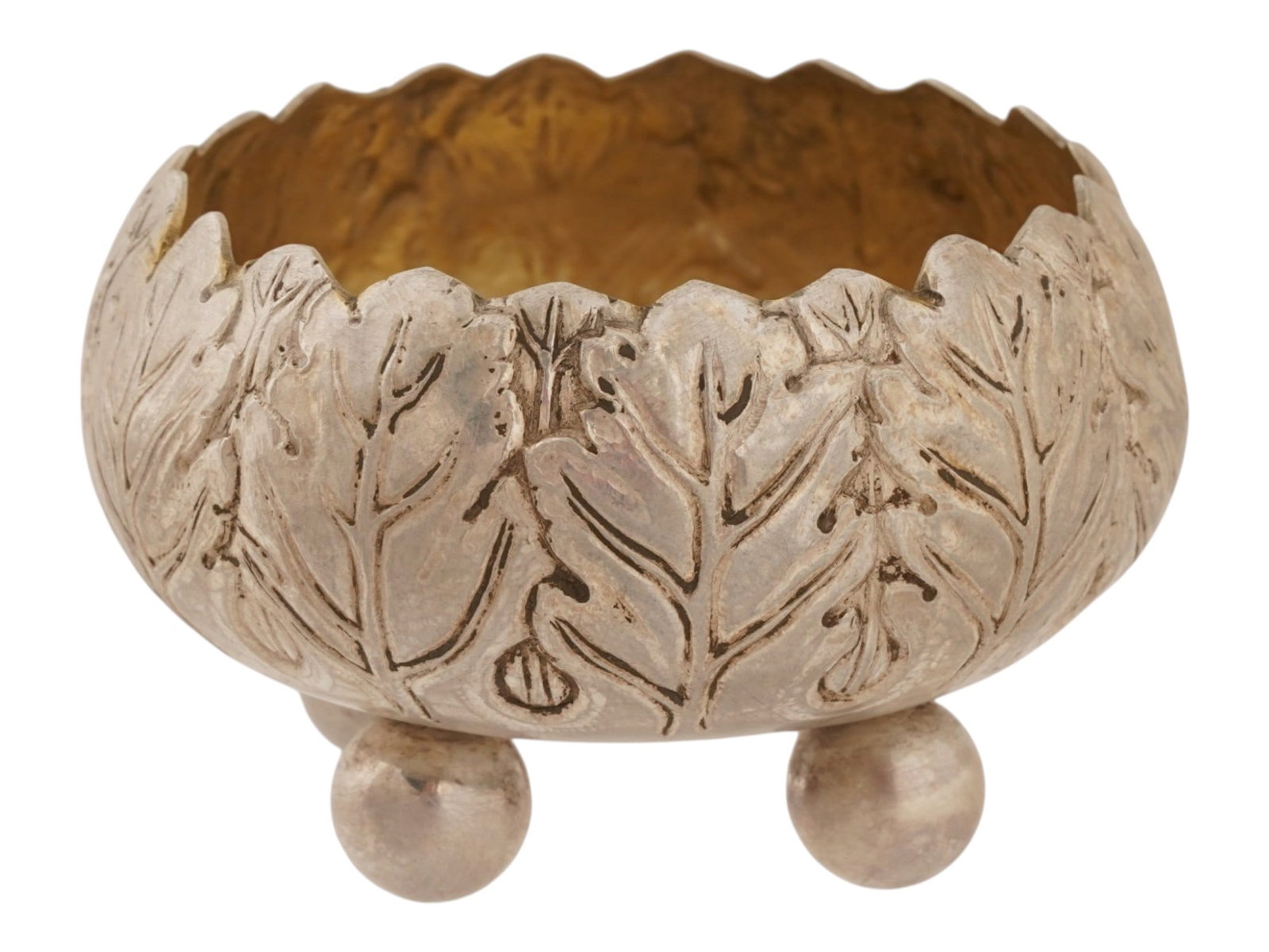 LARGE RUSSIAN SILVER SALT CELLAR: A Russian silver salt cellar. Rounded piece with repousse oak leaf design. The cellar rests on four ball feet. The interior is gilt. Hallmark of 84 silver standard and makers mark on the bottom. Colle
