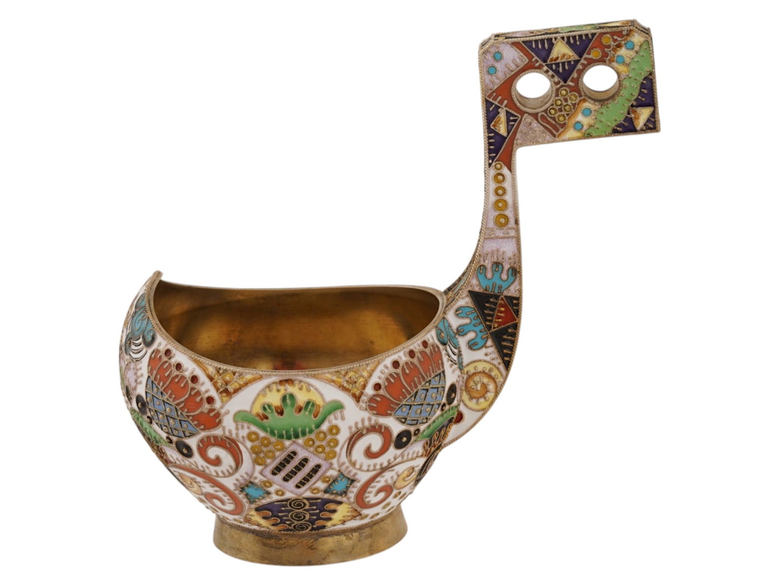 RUSSIAN GILT SILVER ENAMELED KOVSH WITH HANDLE: A Russian traditionally shaped gilt silver kovsh. Features a round base and raised handle with two holes. A gilt wash interior. The exterior of the kovsh is enameled with multicolor geometrical and fl