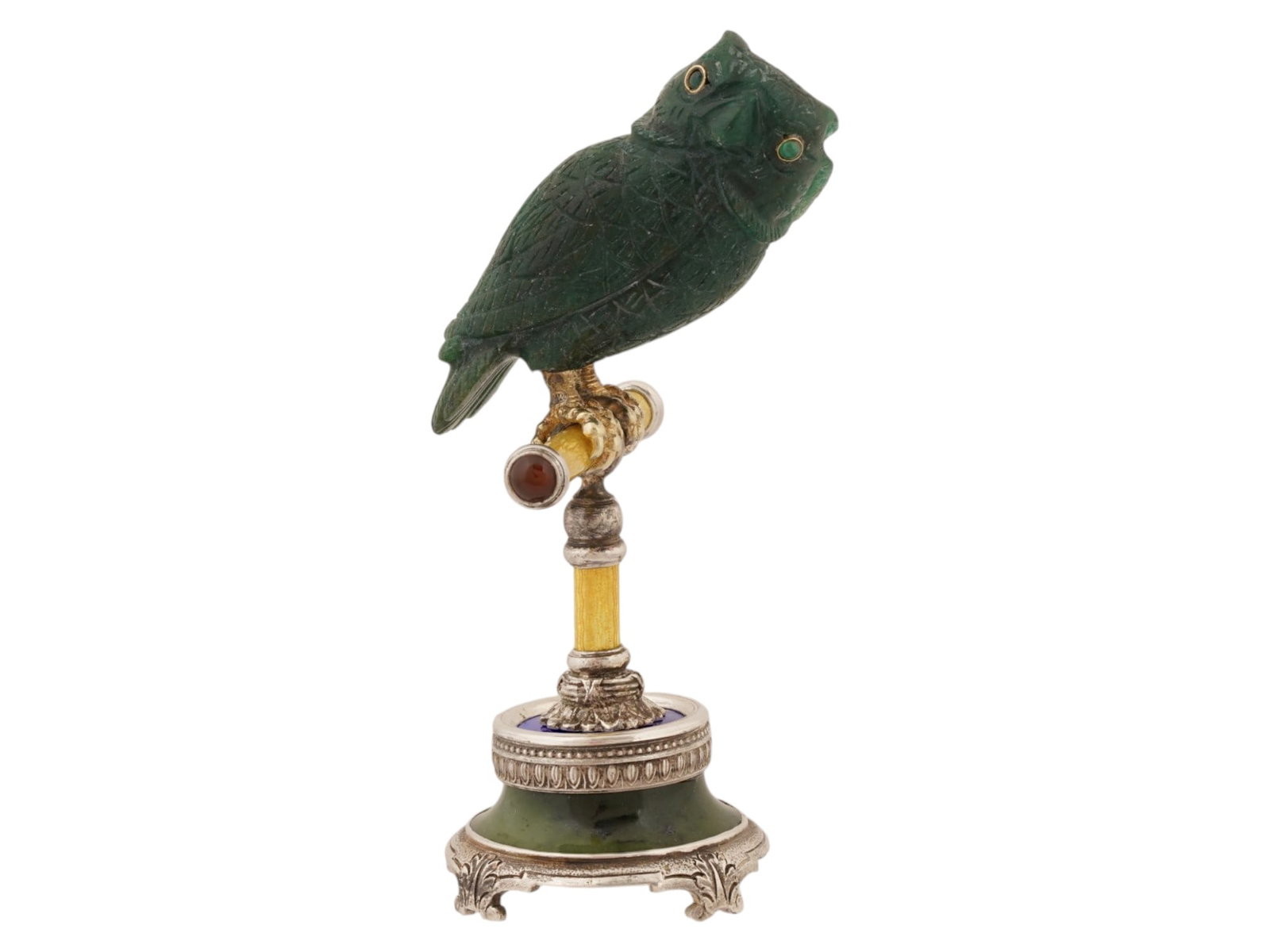 RUSSIAN NEPHRITE JADE OWL FIGURE ON SILVER ENAMEL STAND: A Russian carved nephrite jade figurine modeled as an owl, mounted on a silver and nephrite stand decorated with green guilloche enamel. The figure is accented with emerald eyes set in gold mounts. Ha