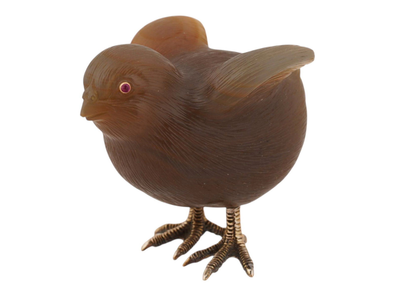 RUSSIAN CARVED AGATE FIGURINE BIRD W GOLD RUBY EYES: A Russian hand carved honey Agate figurine representing a chick, engraved with detailed patterns. The eyes of the figure are set with Ruby cabochons in Gold fittings. Gilt silver feet, hallmarked 88 s