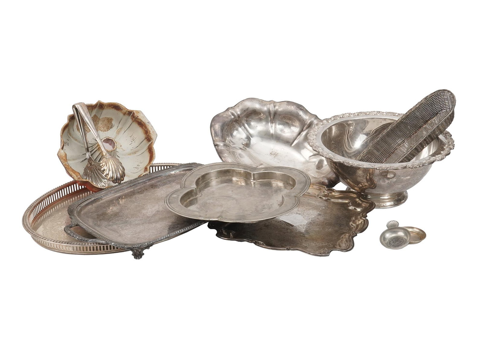 GROUP OF ANTIQUE SILVER PLATED KITCHEN TABLE WARE: A collection of antique and vintage silver plated table wares and kitchen accessories. The collection includes trays in various shapes with relief borders, one footed tray with a pair of handles, a si