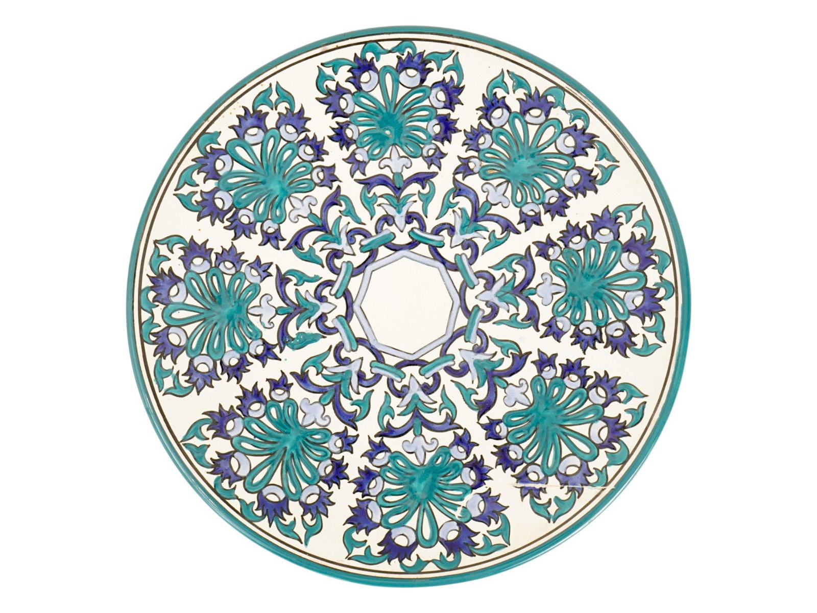 ORIENTAL MANNER HAND PAINTED CERAMIC PLATE MARKED: An Oriental manner hand painted ceramic plate. The plate is adorned with a blue and turquoise floral pattern in the Ottoman or Iznik style. Marked with a manufacturer stamp, on the backside. Antique a