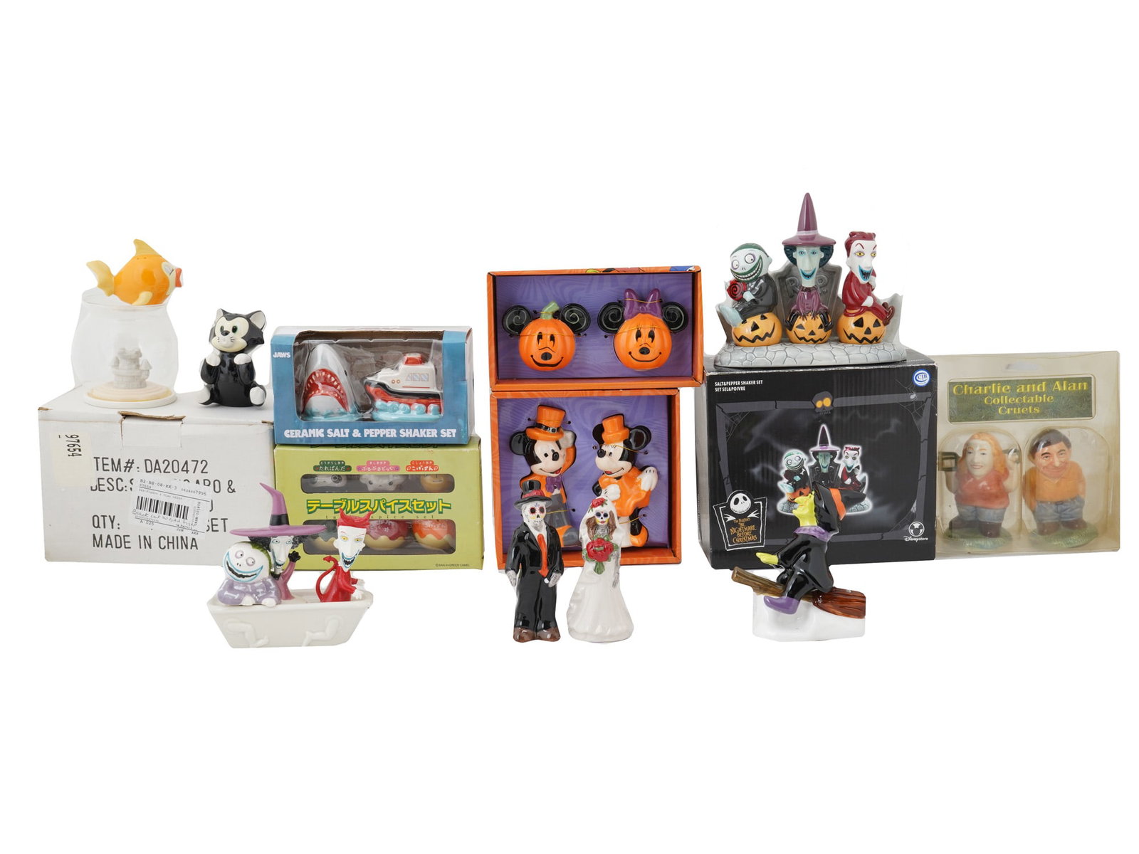 VINTAGE ASSORTED DISNEY CERAMIC SALT PEPPER SHAKERS: A collection of vintage assorted ceramic salt and pepper shakers. The lot contains salt and pepper shakers whose design is based on various TV shows and cartoons, including Walt Disney. Produced appro