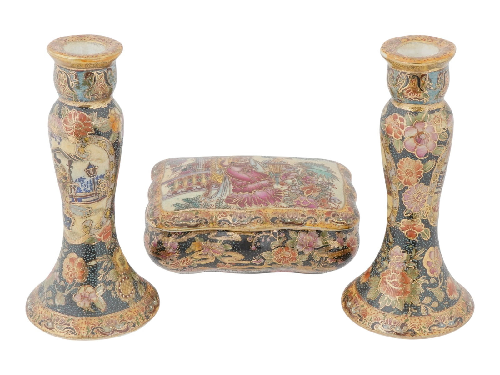 CHINESE SATSUMA PAINTED PORCELAIN SET CANDLE STICKS BOX: A Chinese Satsuma hand painted porcelain set. The set includes a pair of candle sticks and a covered box. The candle sticks are adorned with hand painted medallions representing courtyard genre scenes