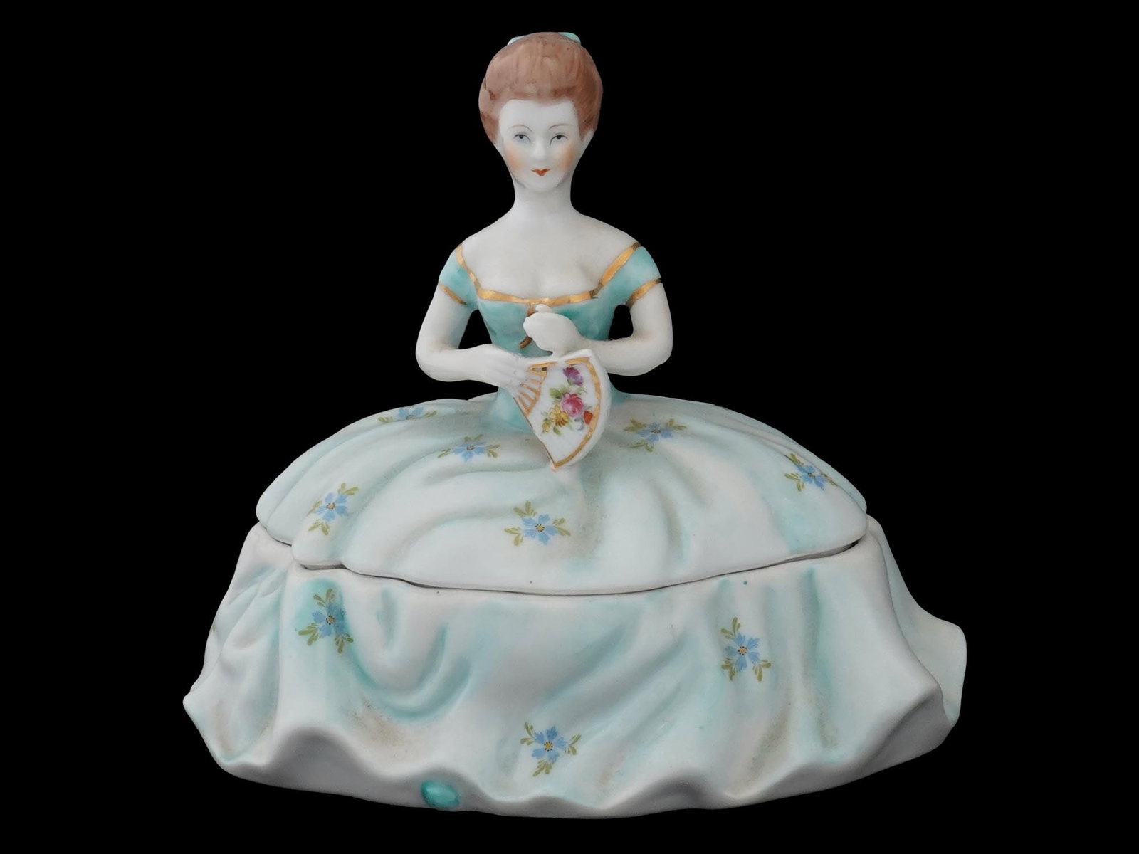 VINTAGE FRENCH LIMOGES CHINA FIGURAL TRINKET BOX: A vintage French porcelain trinket box. The piece is shaped as a woman in ball dress. Transfer-printed decoration and gilding. Marked Limoges China on the bottom. Collectible Porcelain Ware, Decor, Va