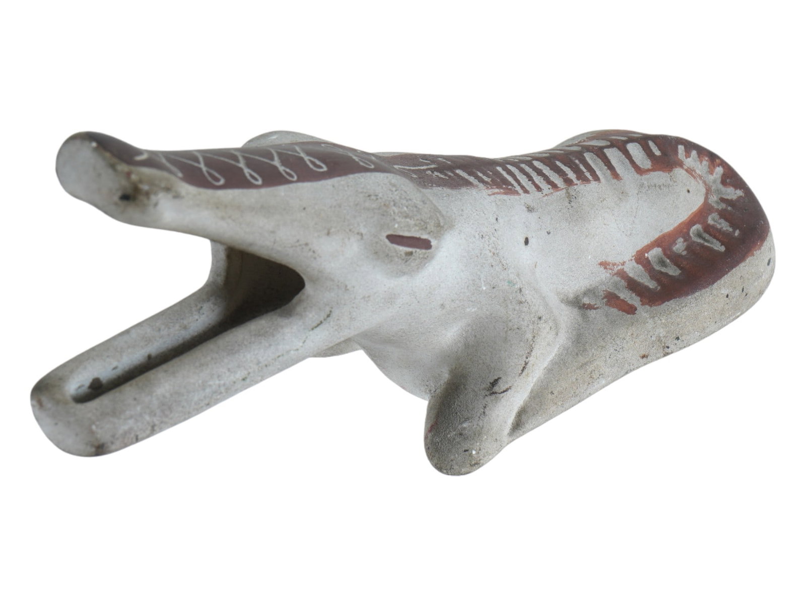VINTAGE CERAMIC ALLIGATOR FIGURINE MID 20TH CEN: A vintage ceramic alligator figurine. The white ceramic Alligator is depicted with an open mouth, raised on its front legs. There is an ethnic pattern in red paint on the back. Marked and numbered 24 