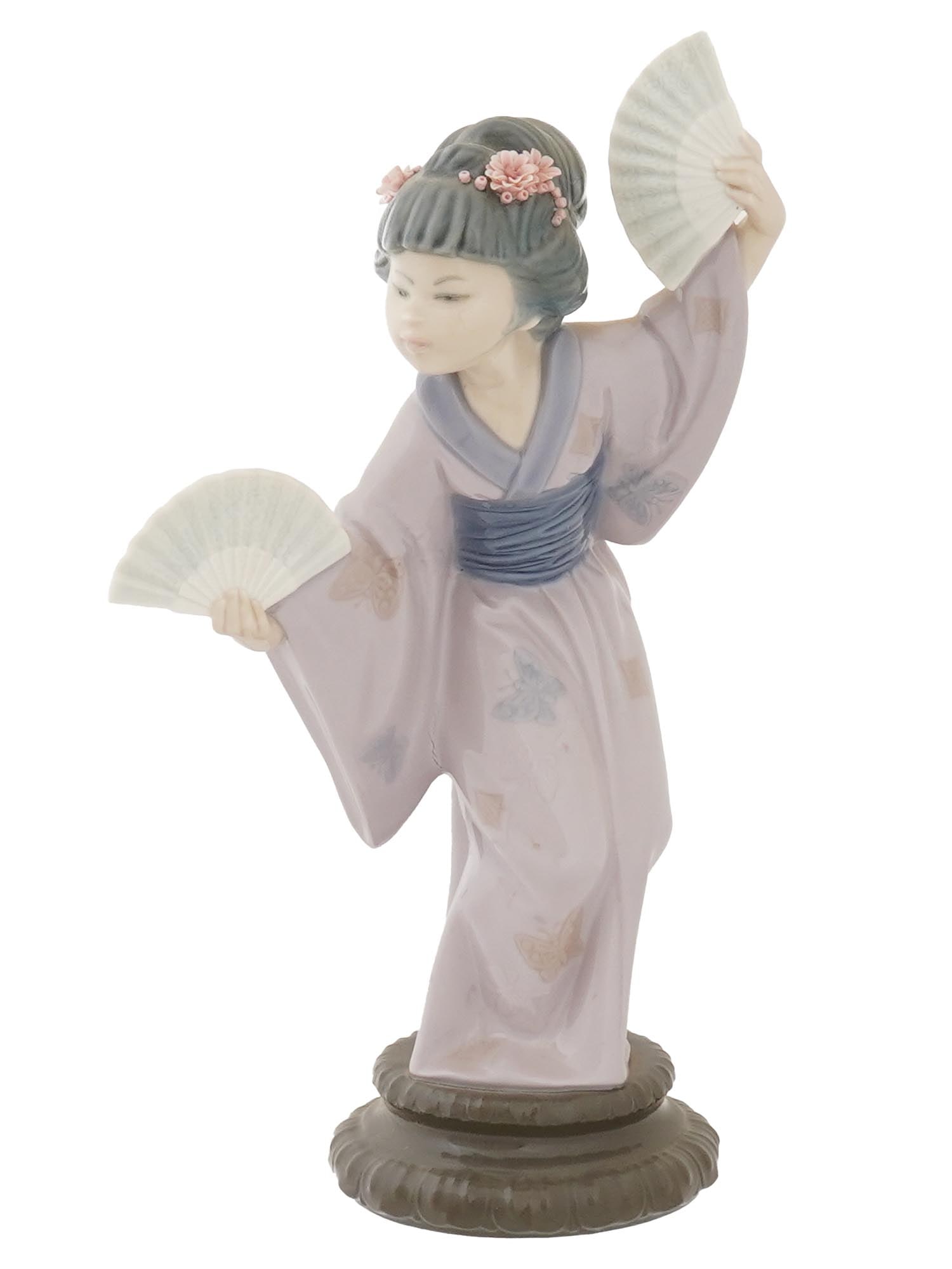 VINTAGE LLADRO PORCELAIN FIGURINE GEISHA IOB: A vintage glazed porcelain figurine by Lladro, a Spanish porcelain manufacture. The figure represents a Japanese woman dancing with fans. Titled Madame Butterfly. Model no. 4991. Hallmark Lladro, Hand